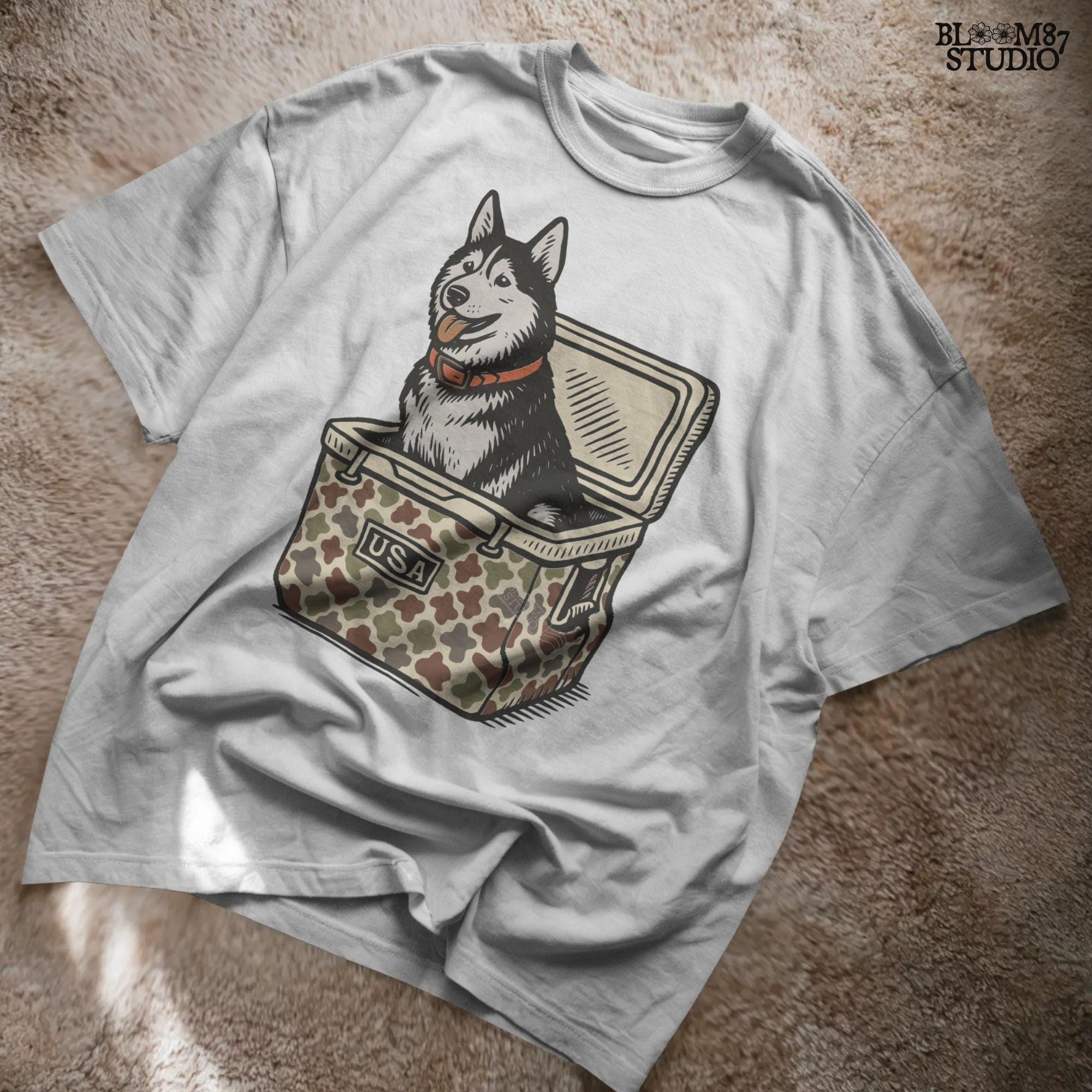Rustic-style husky dog sitting inside a camo USA cooler, digital PNG for patriotic sublimation, hunting gifts, and funny pet-themed crafts