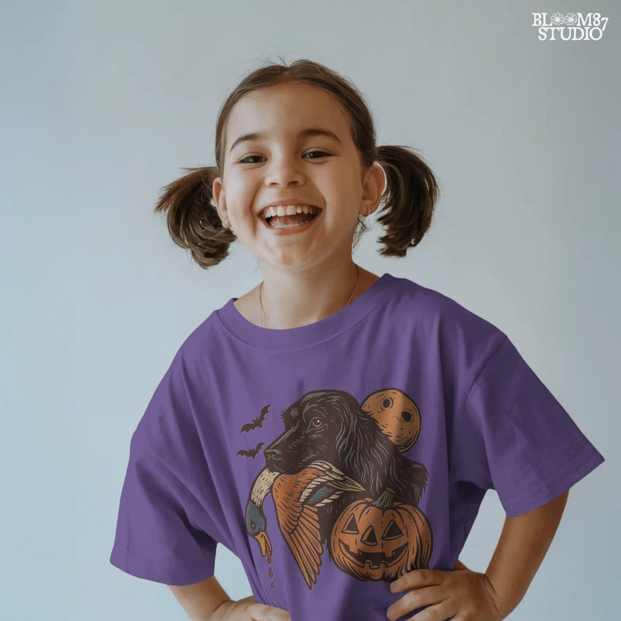 Halloween PNG of a black hunting dog holding a duck with jack-o’-lanterns, bats, and a full moon, rustic sublimation for fall crafts