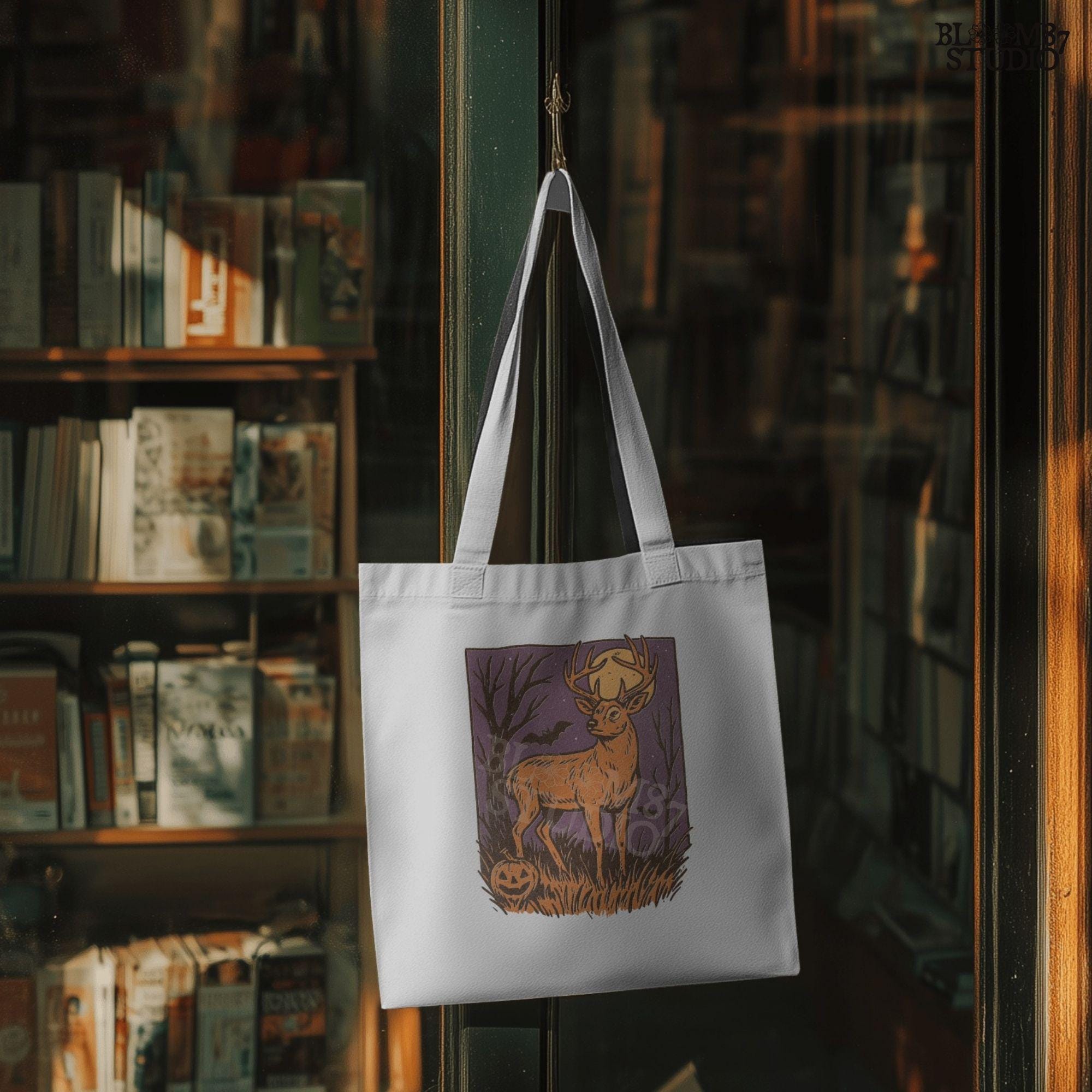 Halloween PNG design of a deer buck under full moon with jack-o’-lantern, bats, and spooky forest background in fall colors