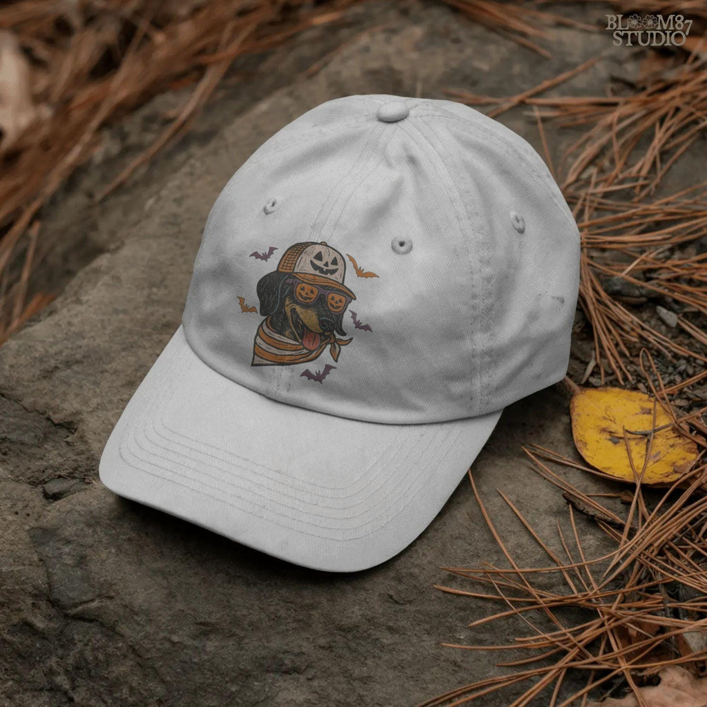 Halloween dachshund wearing pumpkin sunglasses, jack-o’-lantern hat, and orange bandana with flying bats, sublimation PNG design