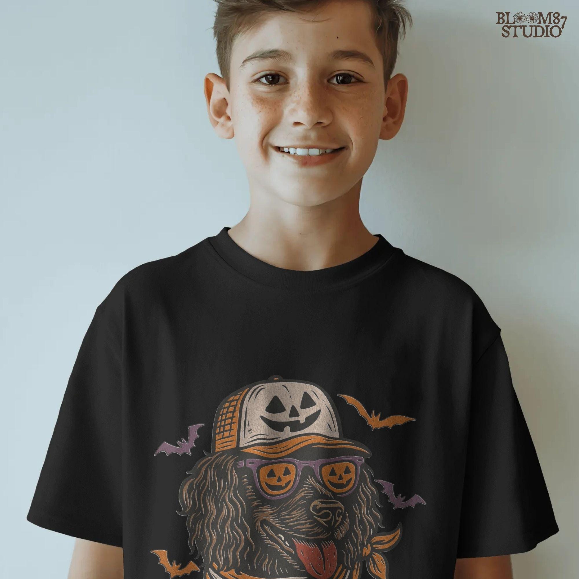 Boykin Spaniel dog wearing pumpkin sunglasses and Halloween hat with bats flying around, spooky sublimation PNG design for fall shirts
