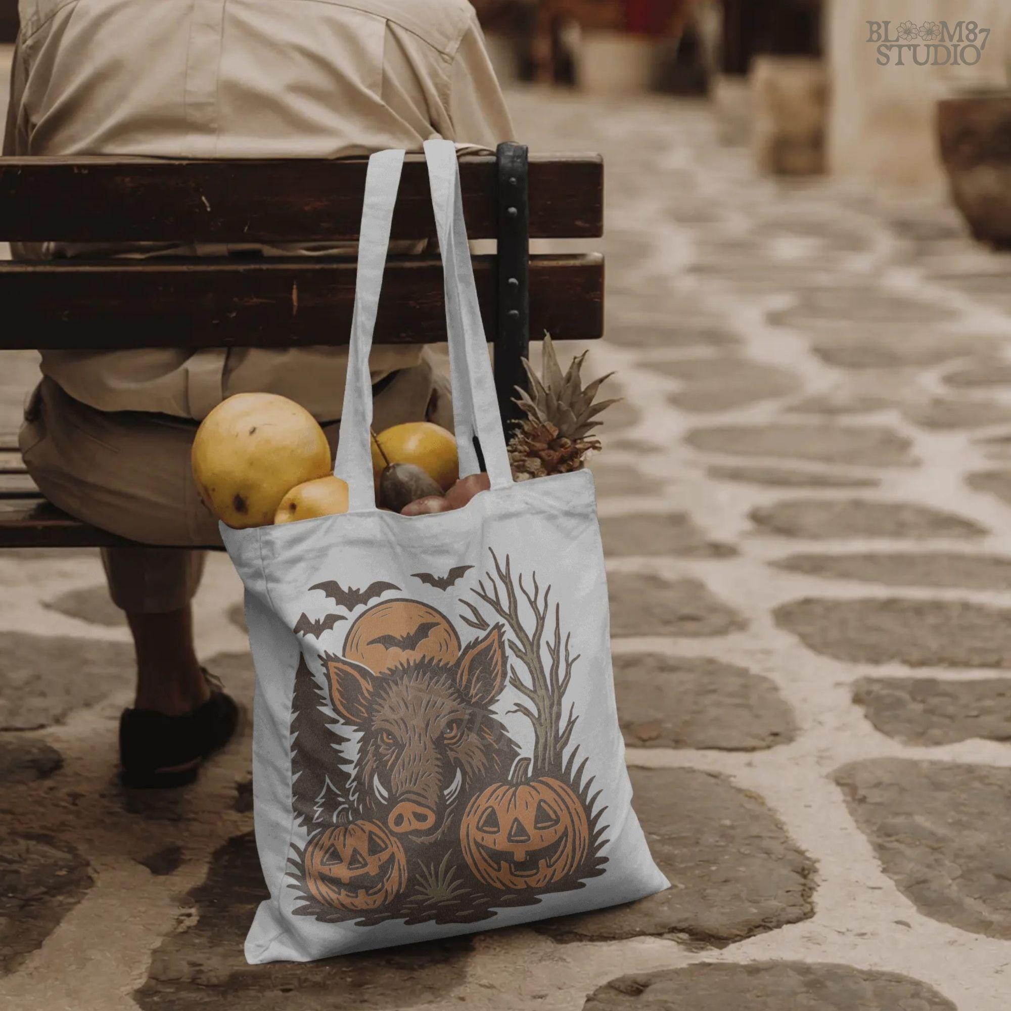 Halloween wild boar sublimation PNG featuring a fierce hog with jack-o’-lantern pumpkins, bats, and spooky forest background in vintage style