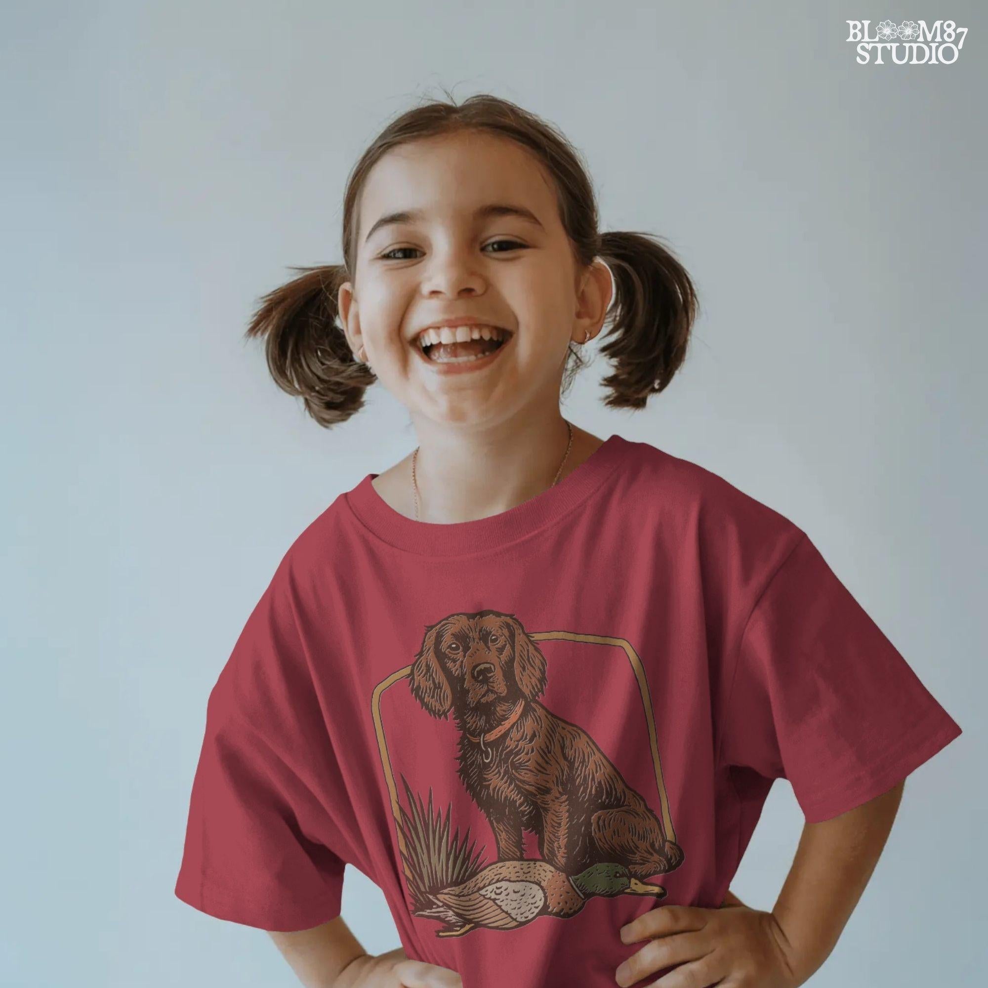 Vintage-style PNG of a Boykin Spaniel dog sitting with a harvested mallard duck, perfect for fall hunting sublimation and Southern dog lovers