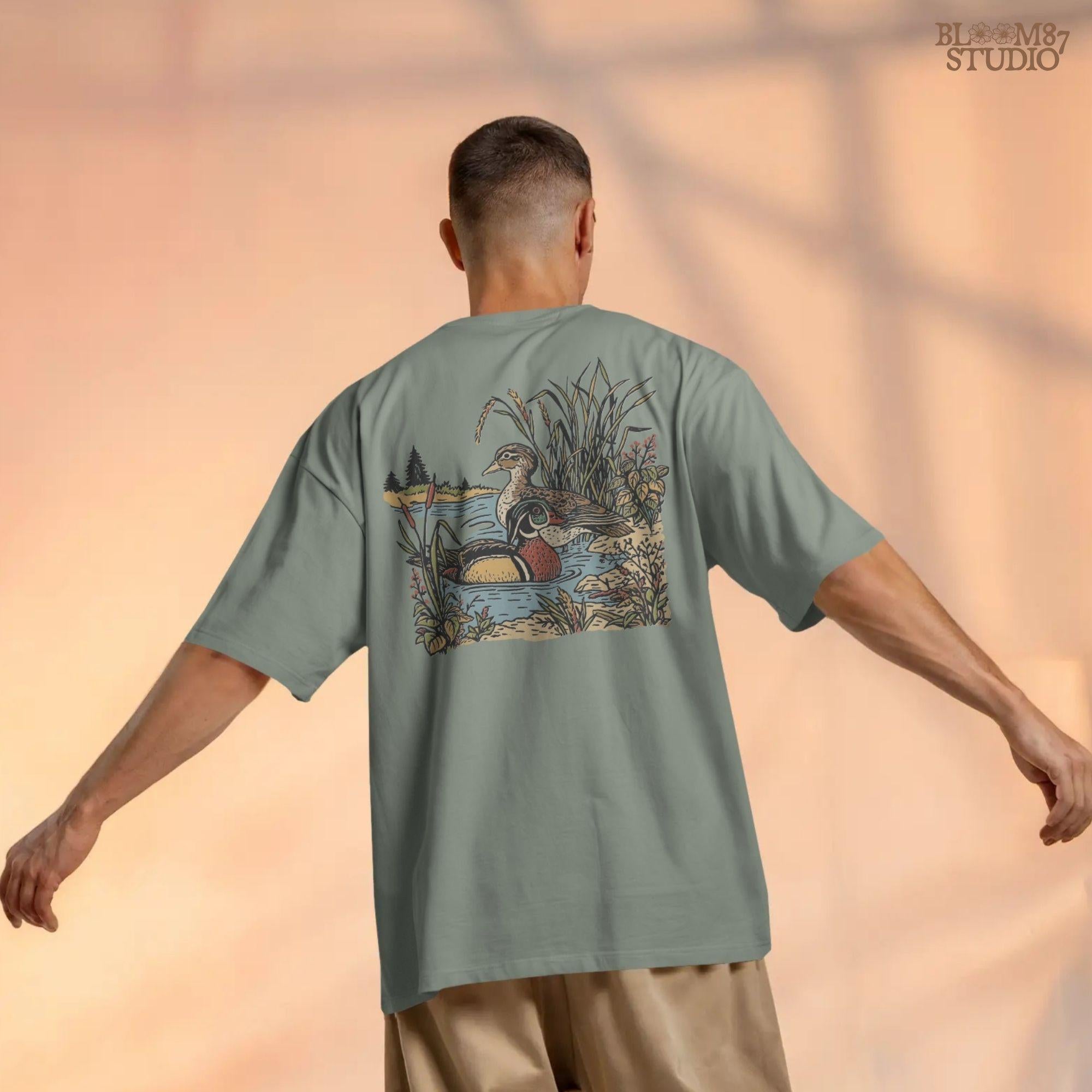 Vintage-style sublimation PNG of two wood ducks in a fall marsh surrounded by cattails and foliage, designed for duck hunting shirts and gifts