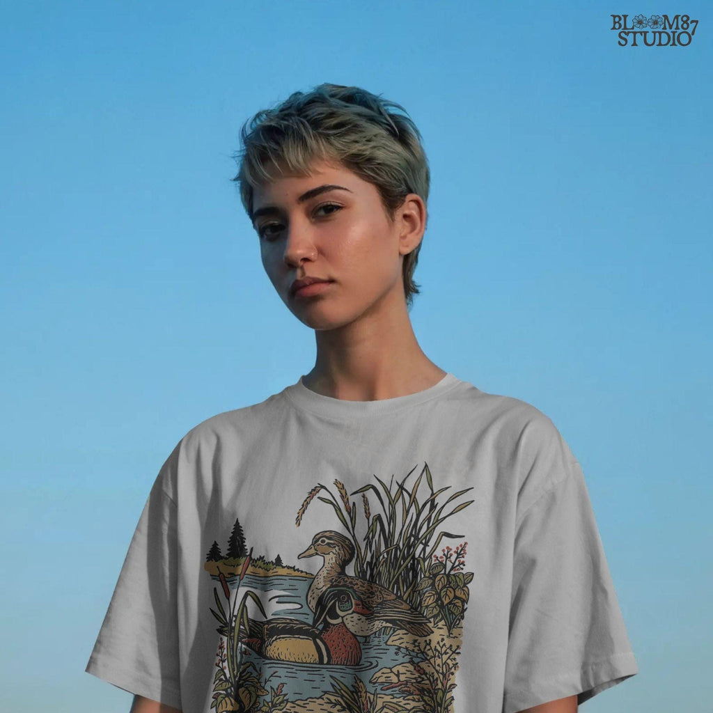 Vintage-style sublimation PNG of two wood ducks in a fall marsh surrounded by cattails and foliage, designed for duck hunting shirts and gifts