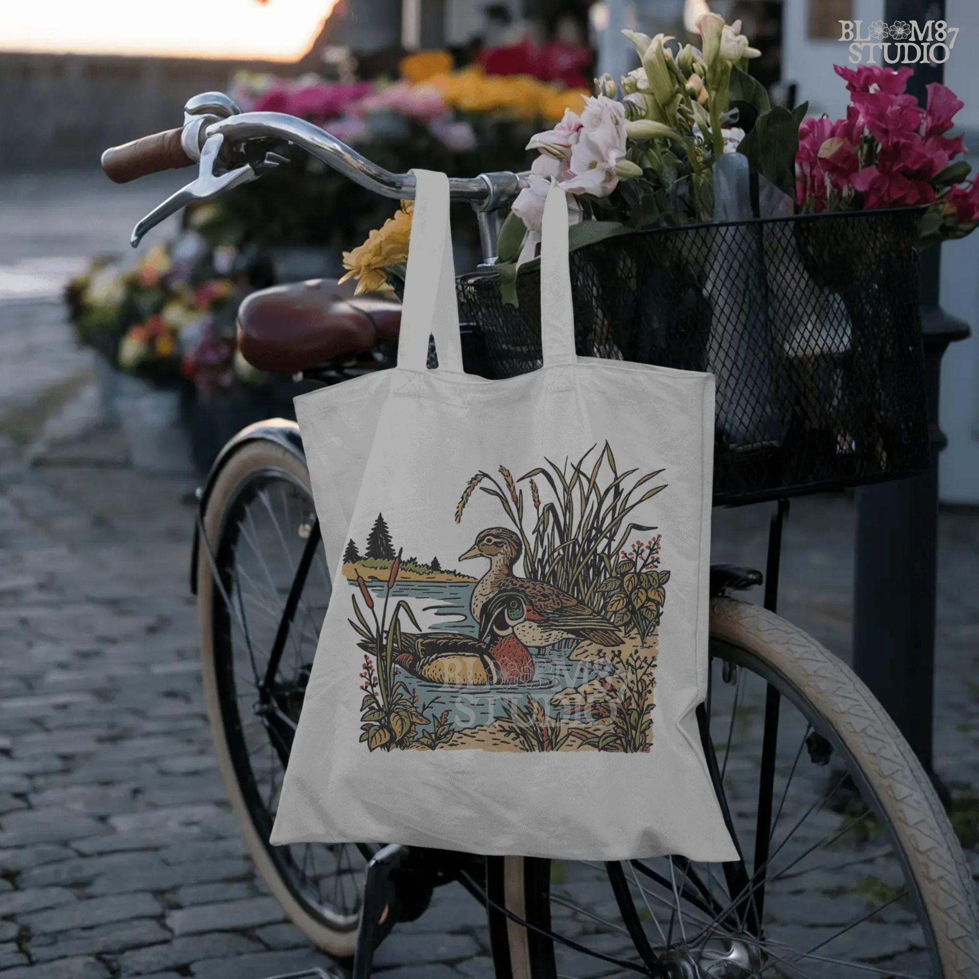 Vintage-style sublimation PNG of two wood ducks in a fall marsh surrounded by cattails and foliage, designed for duck hunting shirts and gifts
