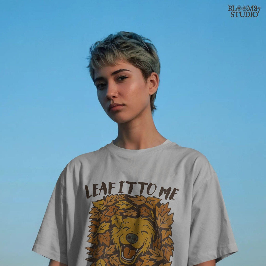 Cute golden retriever surrounded by fall leaves with the phrase “Leaf it to me to love fall”, for autumn dog-themed sublimation projects