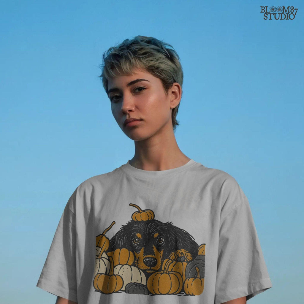 Long-haired dachshund surrounded by fall pumpkins in orange, cream, and gray tones, perfect for autumn sublimation designs and shirts