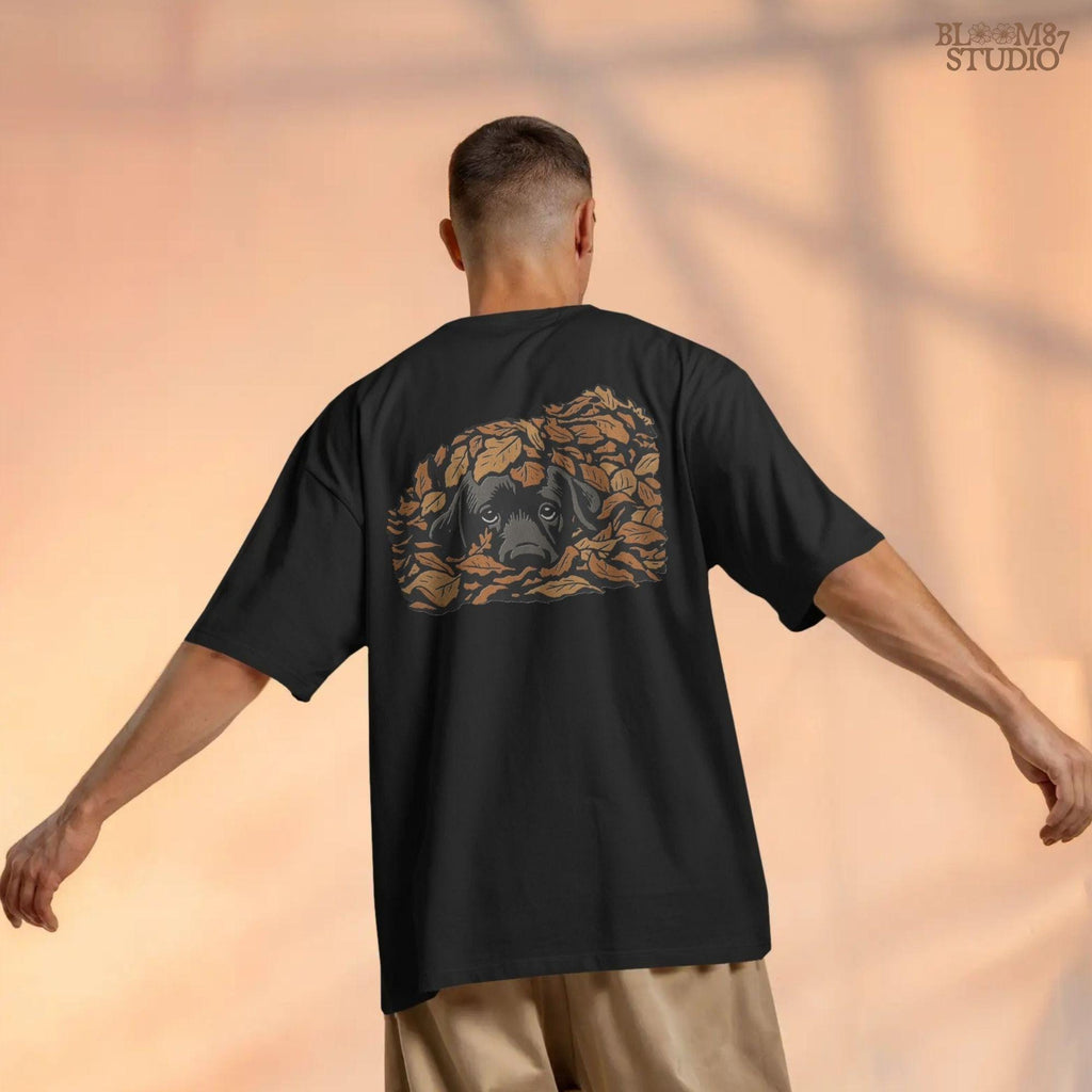 Cute black Labrador retriever peeking through a pile of orange autumn leaves, rustic fall sublimation PNG design