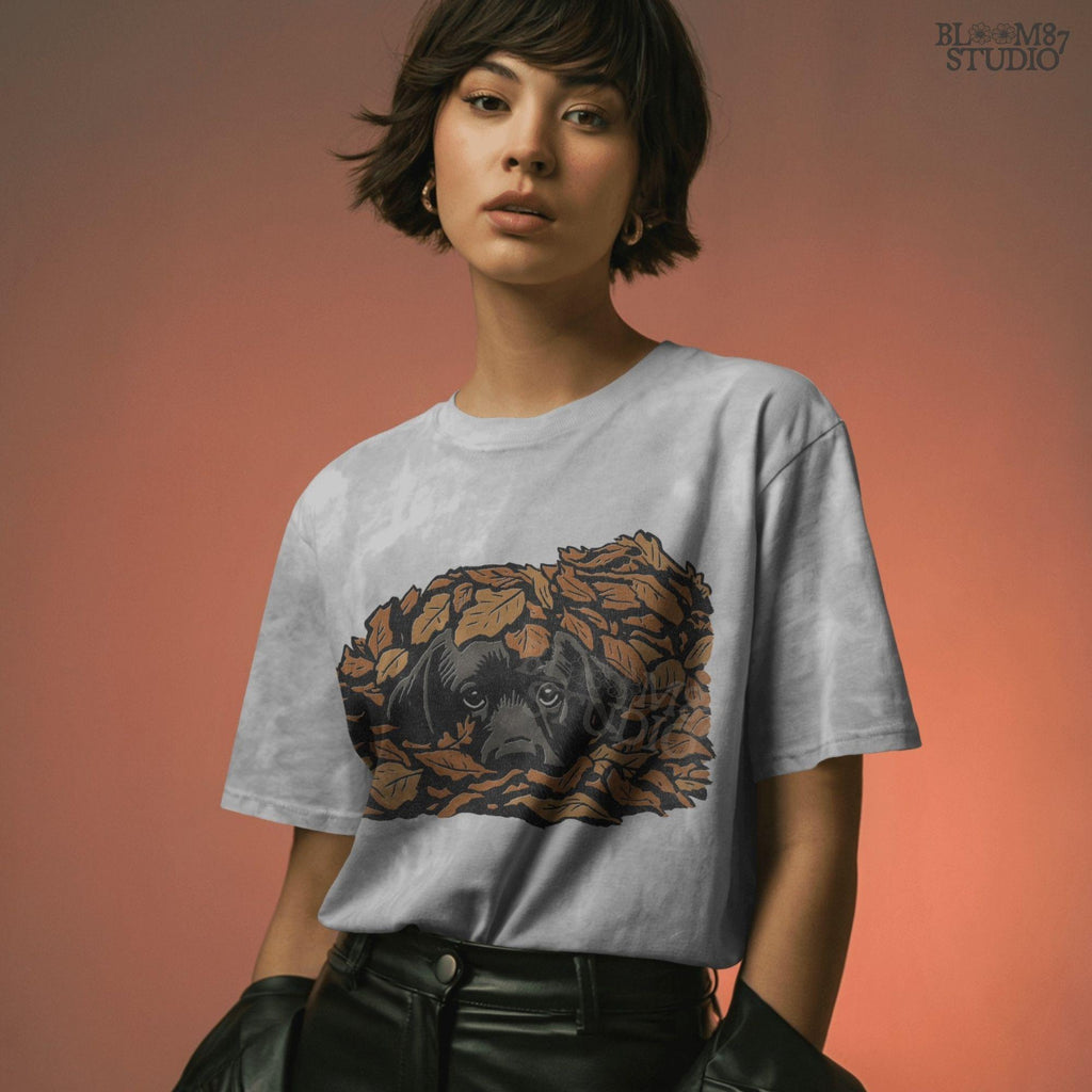 Cute black Labrador retriever peeking through a pile of orange autumn leaves, rustic fall sublimation PNG design