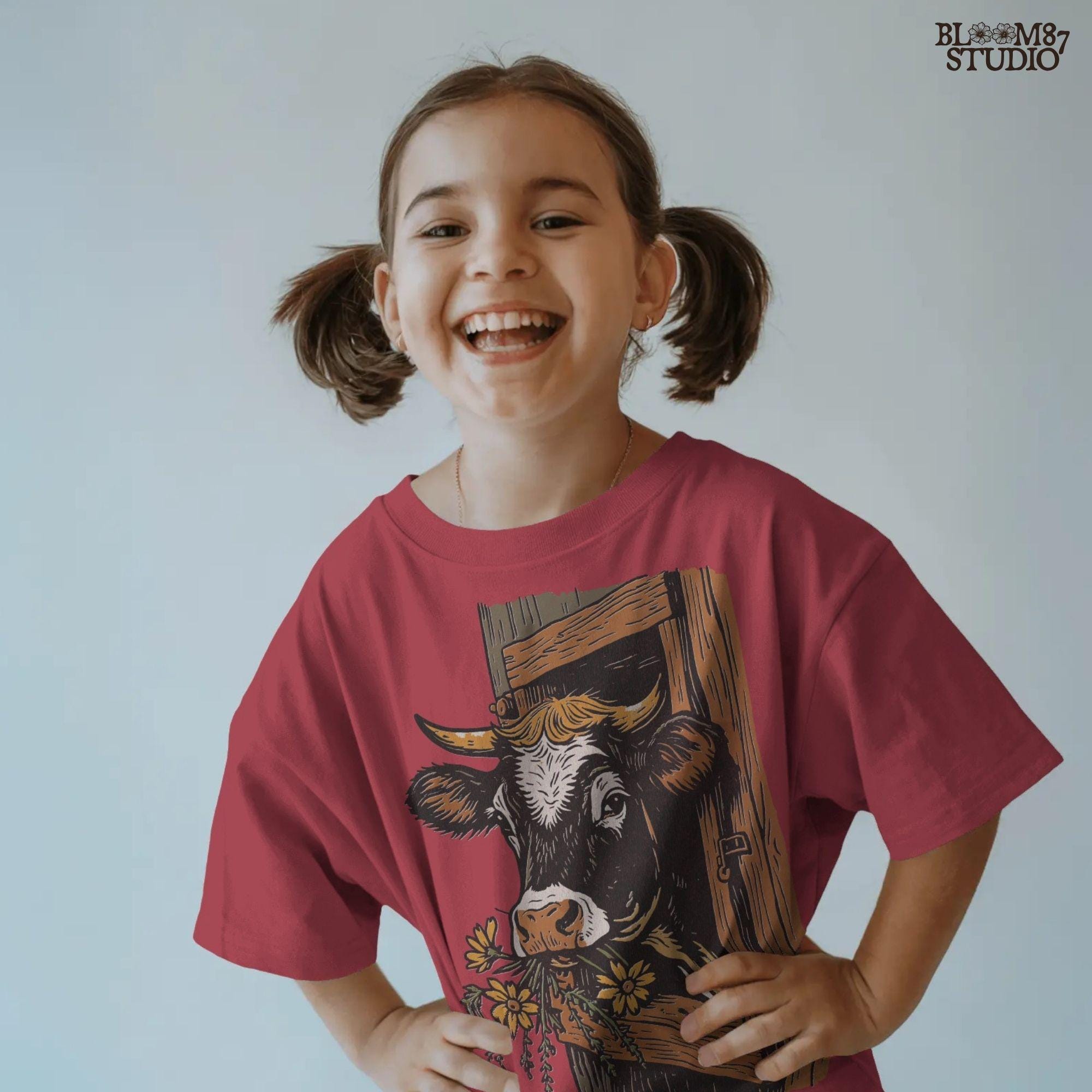 Rustic black and white cow peeking through a wooden barn window, holding yellow wildflowers in its mouth, farm sublimation PNG design