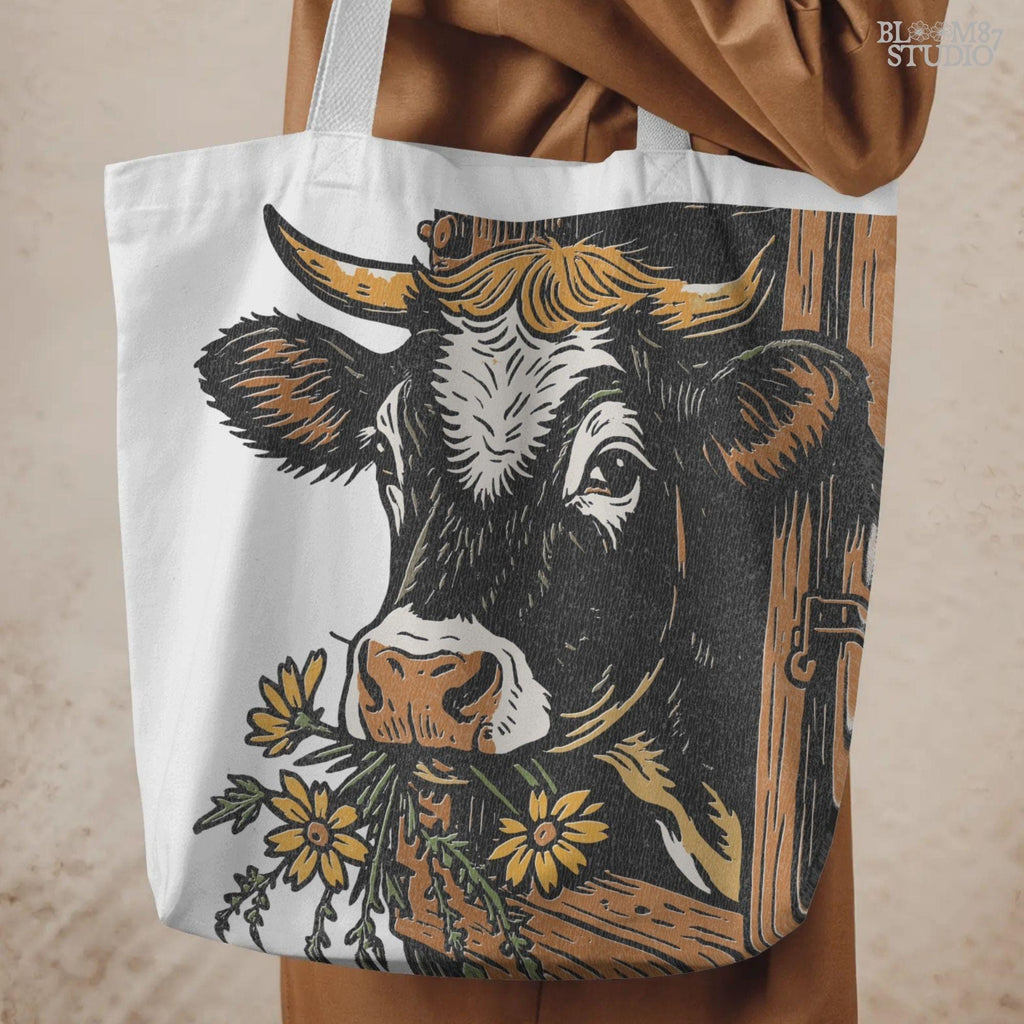 Rustic black and white cow peeking through a wooden barn window, holding yellow wildflowers in its mouth, farm sublimation PNG design