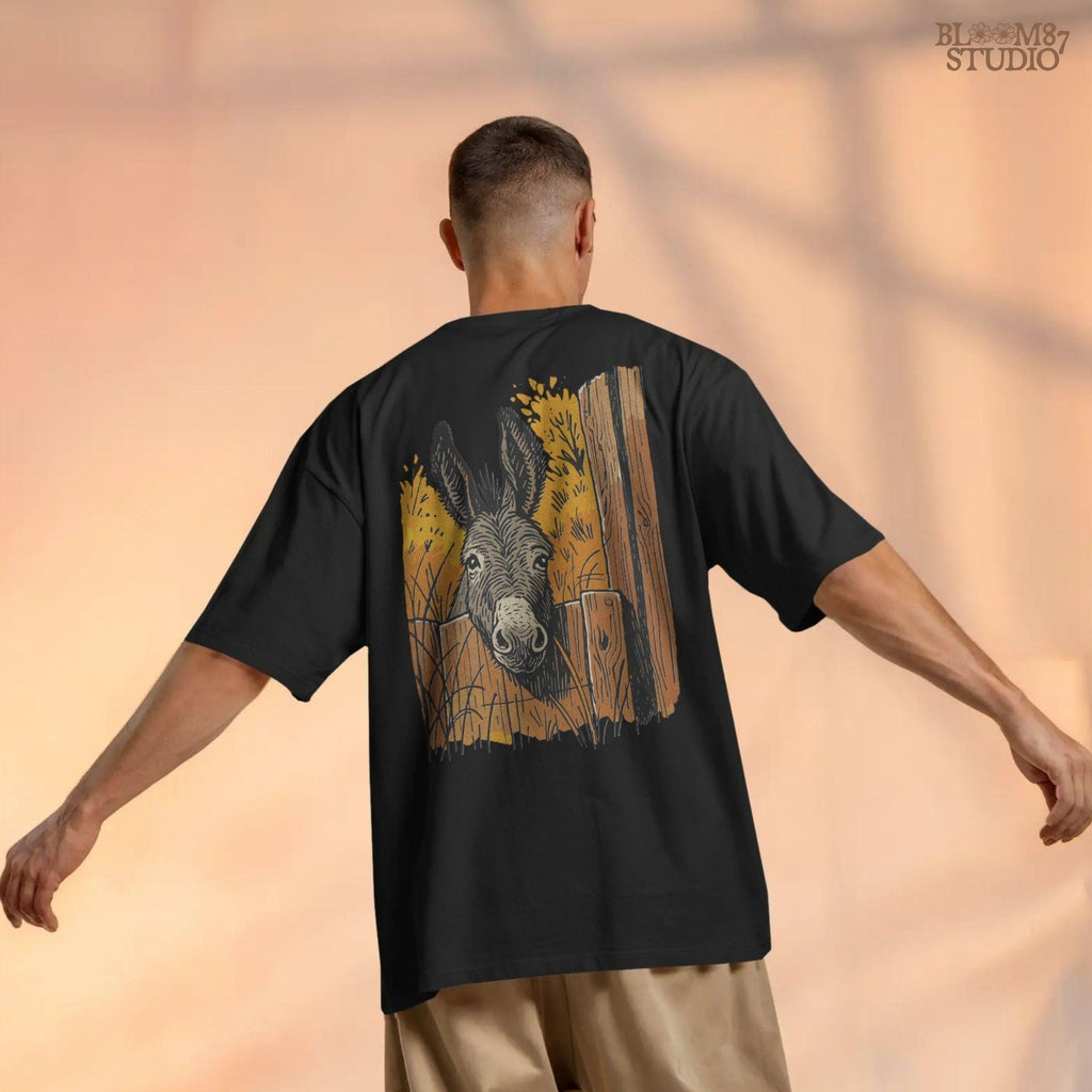 Vintage-style donkey looking through a rustic wooden fence with golden fall foliage in the background, perfect for sublimation crafts