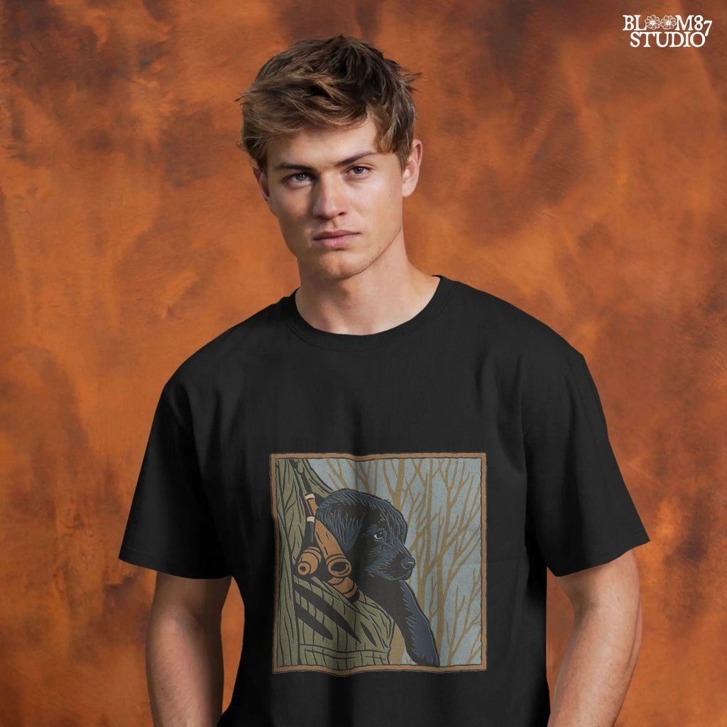 Black Labrador puppy sitting in a camo hunting vest with duck calls, perfect for fall hunting season sublimation designs.