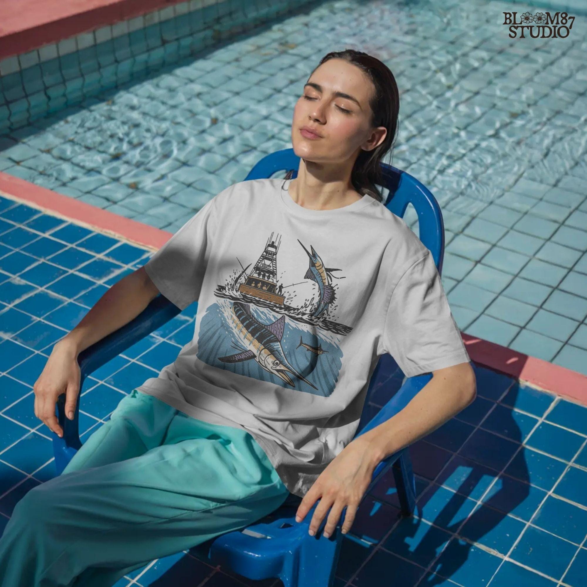 Illustration of a blue marlin jumping near a sportfishing boat with underwater and above-water ocean scene, sublimation PNG design