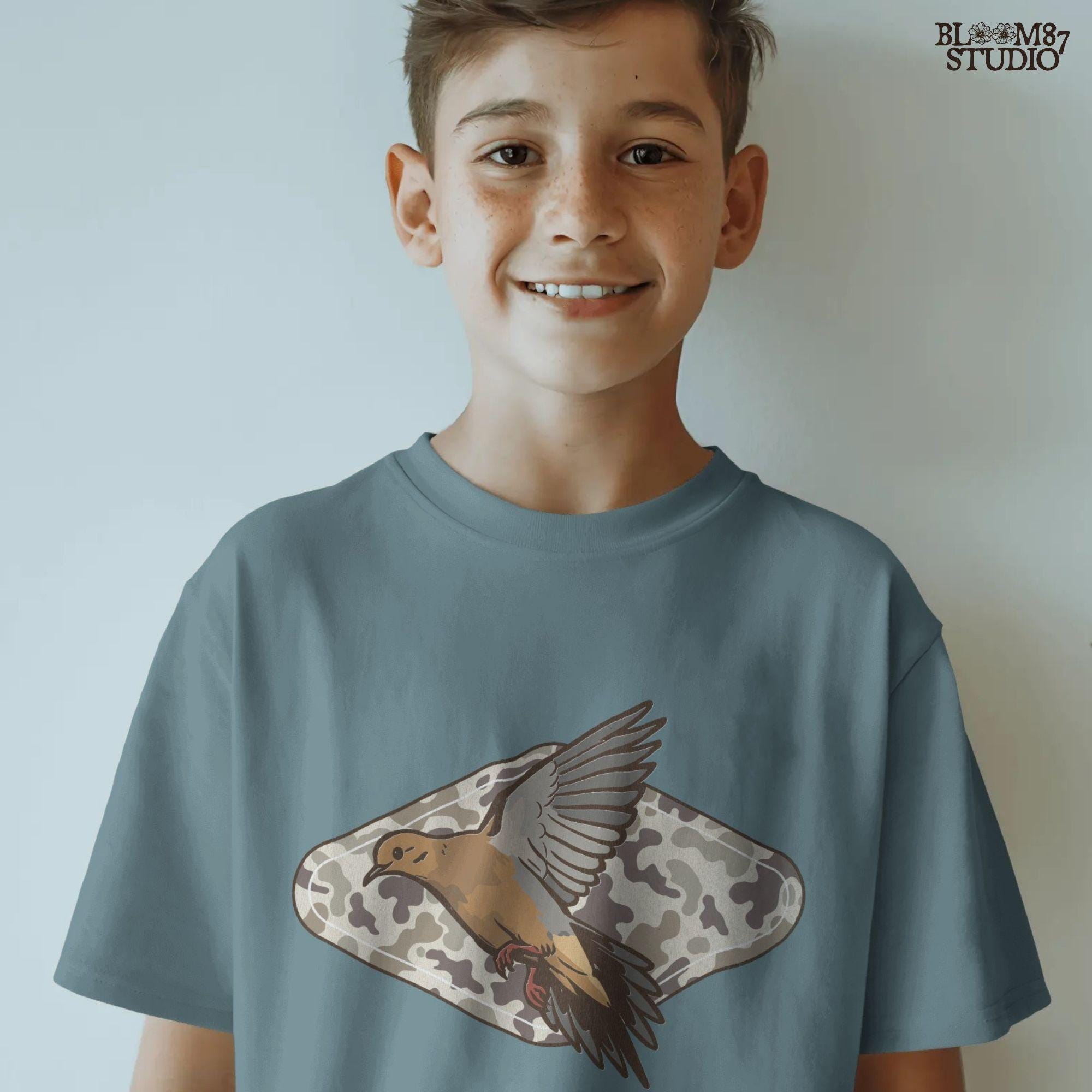 Illustration of a flying mourning dove over a tan and brown camo-patterned background, designed for hunting-themed sublimation prints.