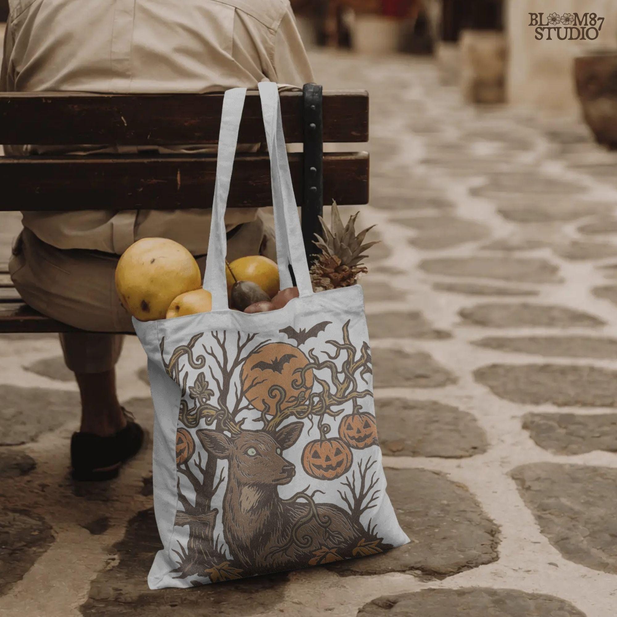 Halloween-themed sublimation PNG of a deer with spiderweb antlers, jack-o’-lantern pumpkins, bats, and a spooky forest background.