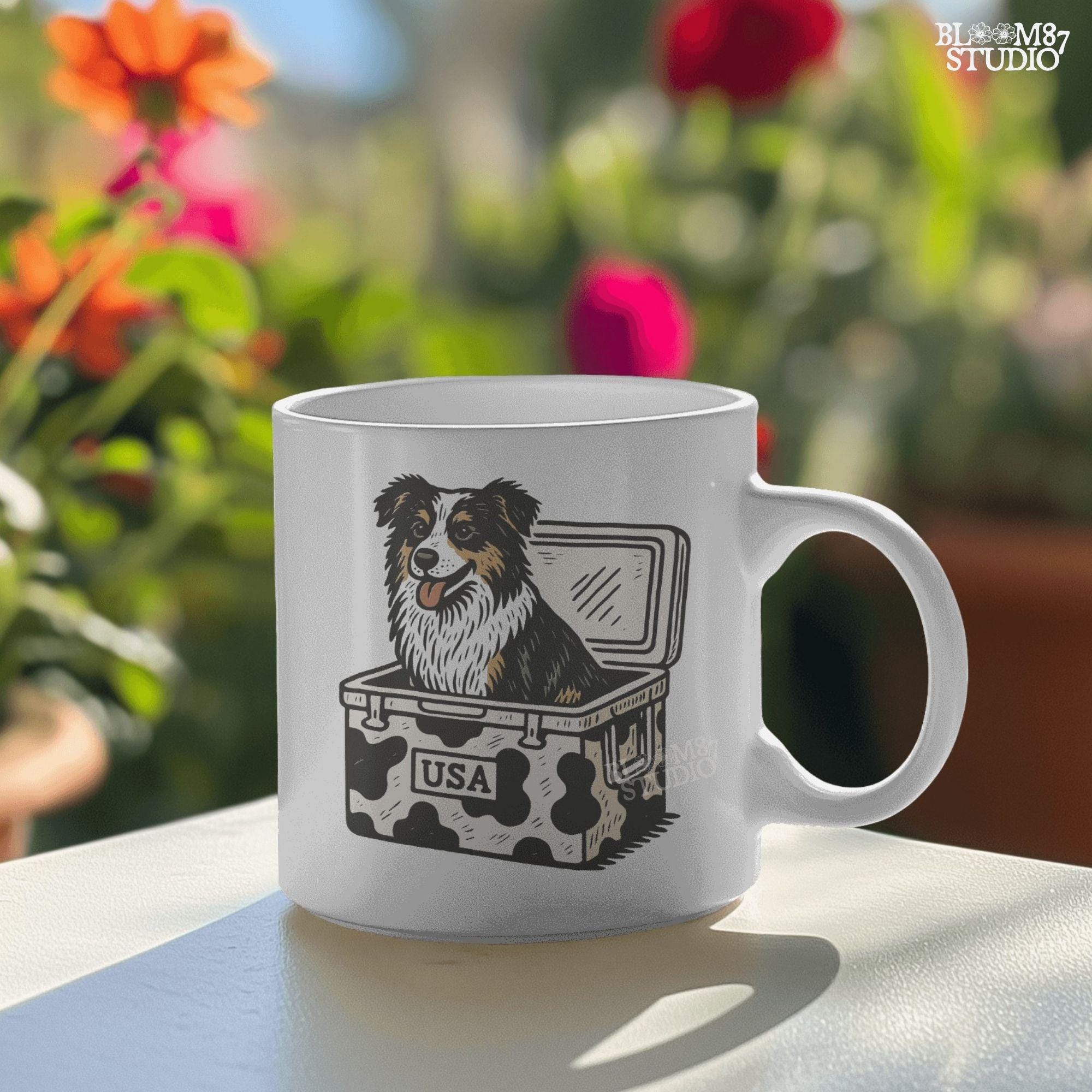 Illustration of an Australian Shepherd dog sitting inside a cowhide-pattern USA cooler; western patriotic sublimation PNG for dog lovers and crafters.