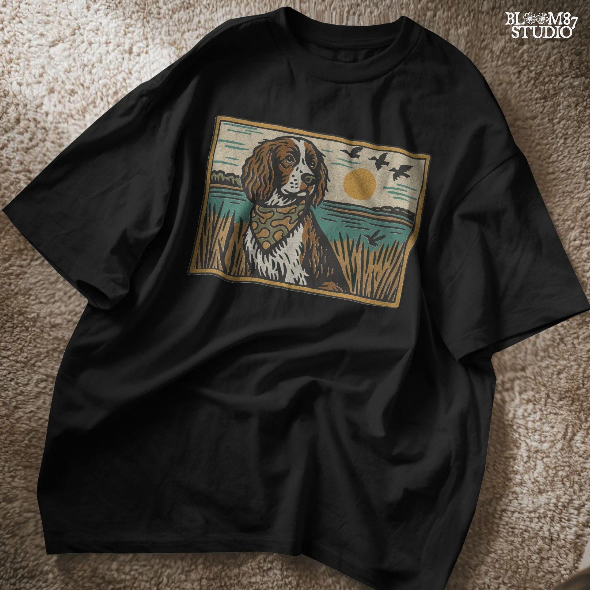 Illustration of a spaniel dog in a camouflage bandana sitting near a lake with sunset and ducks flying overhead; rustic southern sublimation PNG for apparel.
