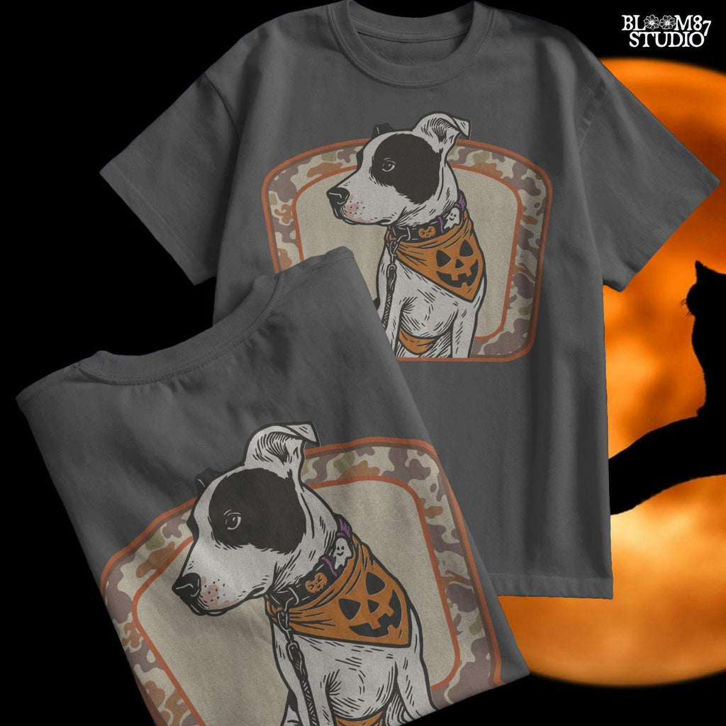 Illustration of a black and white pitbull wearing a jack-o’-lantern bandana and Halloween collar, framed by a camo background.v