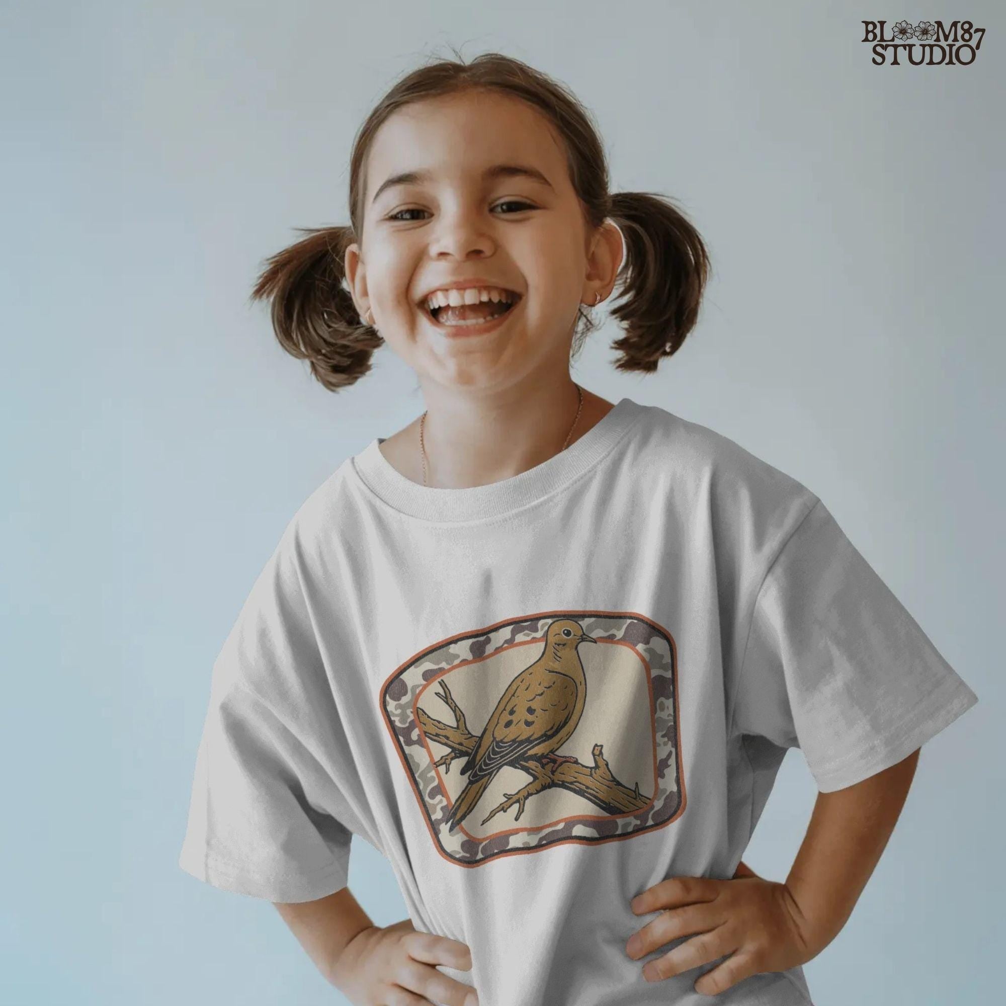 Rustic illustration of a mourning dove perched on a branch with camo border, ideal for hunting season and southern fall sublimation crafts.