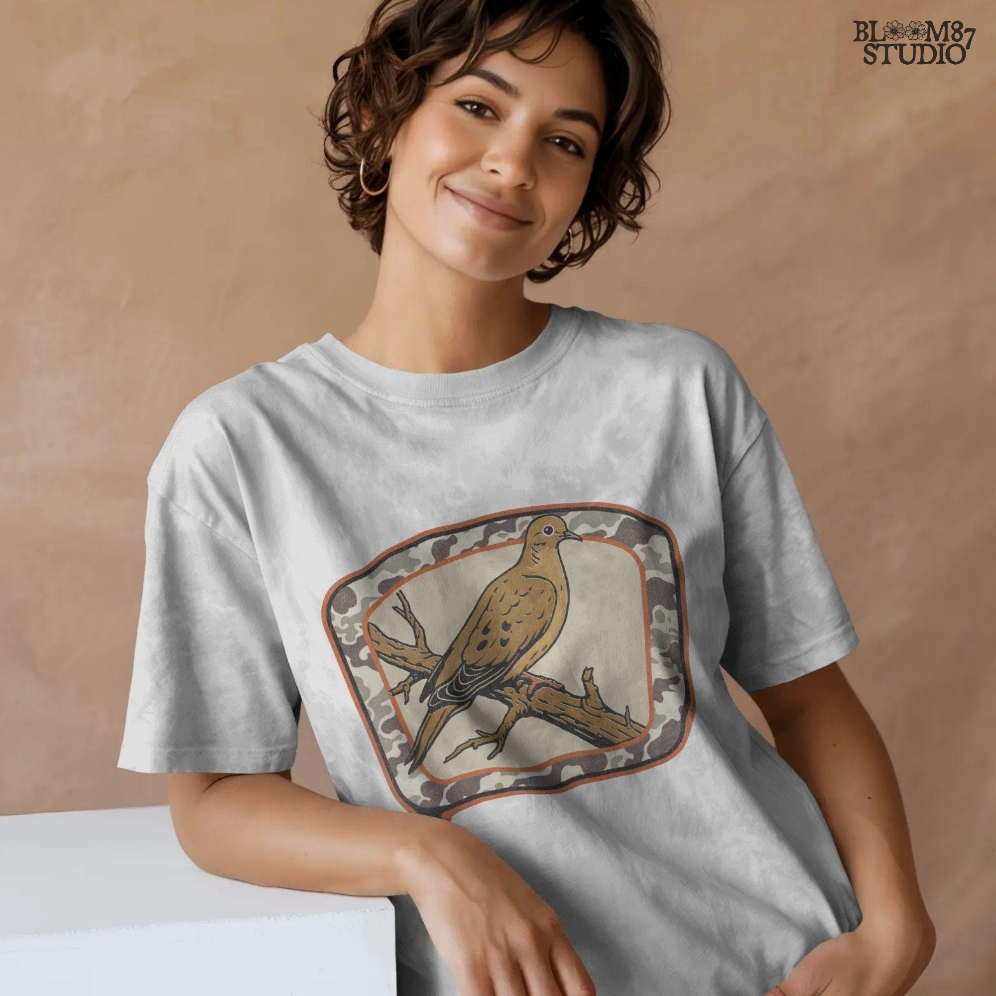 Rustic illustration of a mourning dove perched on a branch with camo border, ideal for hunting season and southern fall sublimation crafts.