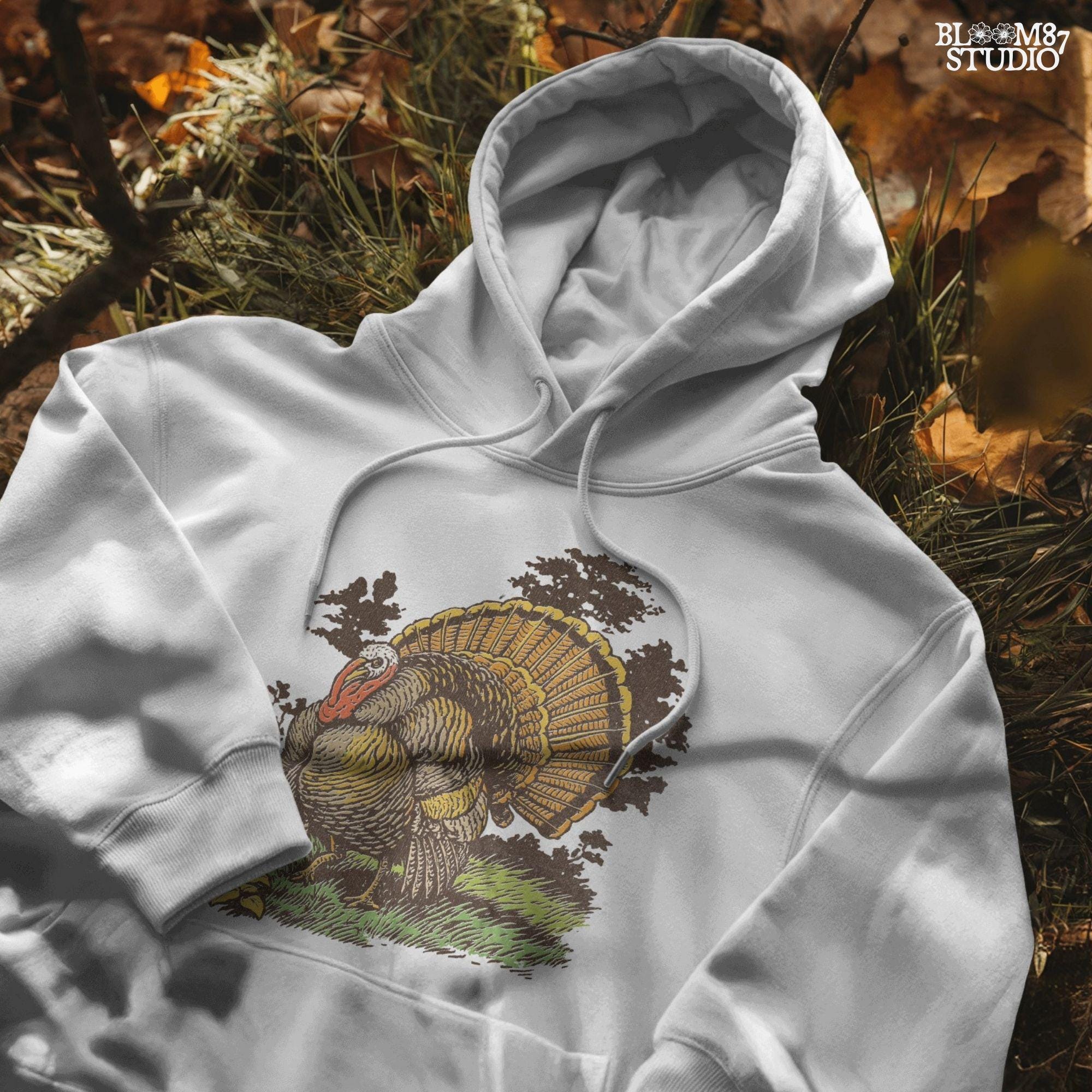Vintage turkey illustration for Thanksgiving sublimation, featuring a detailed rustic tom turkey in fall colors with grass and leaves.
