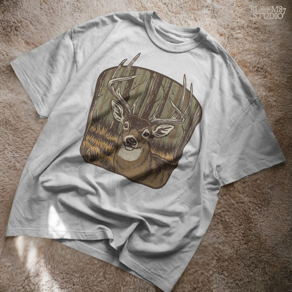 Illustration of a large whitetail buck with full antlers standing in a golden woodland forest, designed for hunting-themed sublimation projects.