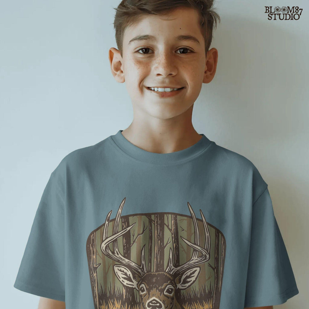 Illustration of a large whitetail buck with full antlers standing in a golden woodland forest, designed for hunting-themed sublimation projects.