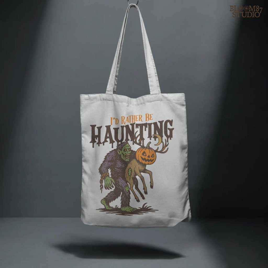 Humorous Halloween sublimation PNG featuring a zombie carrying a deer with a jack-o’-lantern head and the phrase “I’d Rather Be Haunting.”