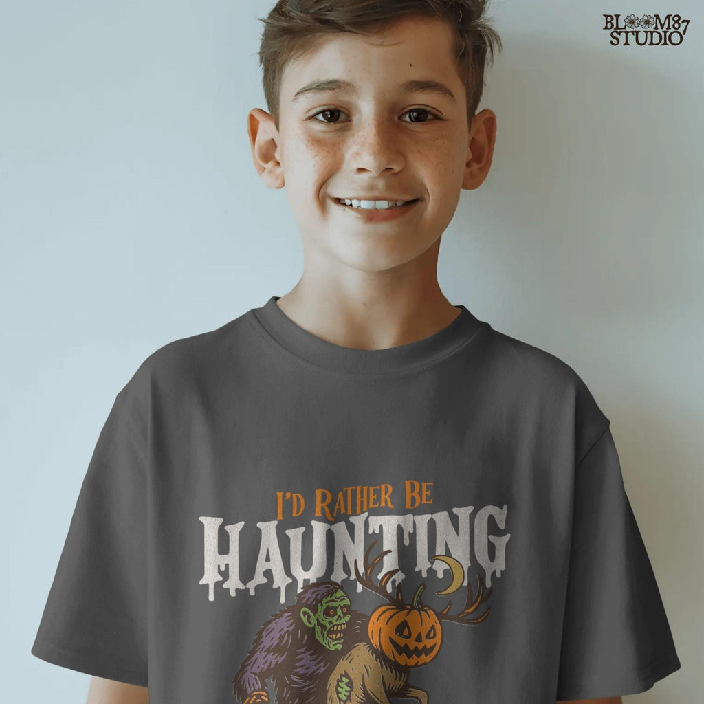 Humorous Halloween sublimation PNG featuring a zombie carrying a deer with a jack-o’-lantern head and the phrase “I’d Rather Be Haunting.”