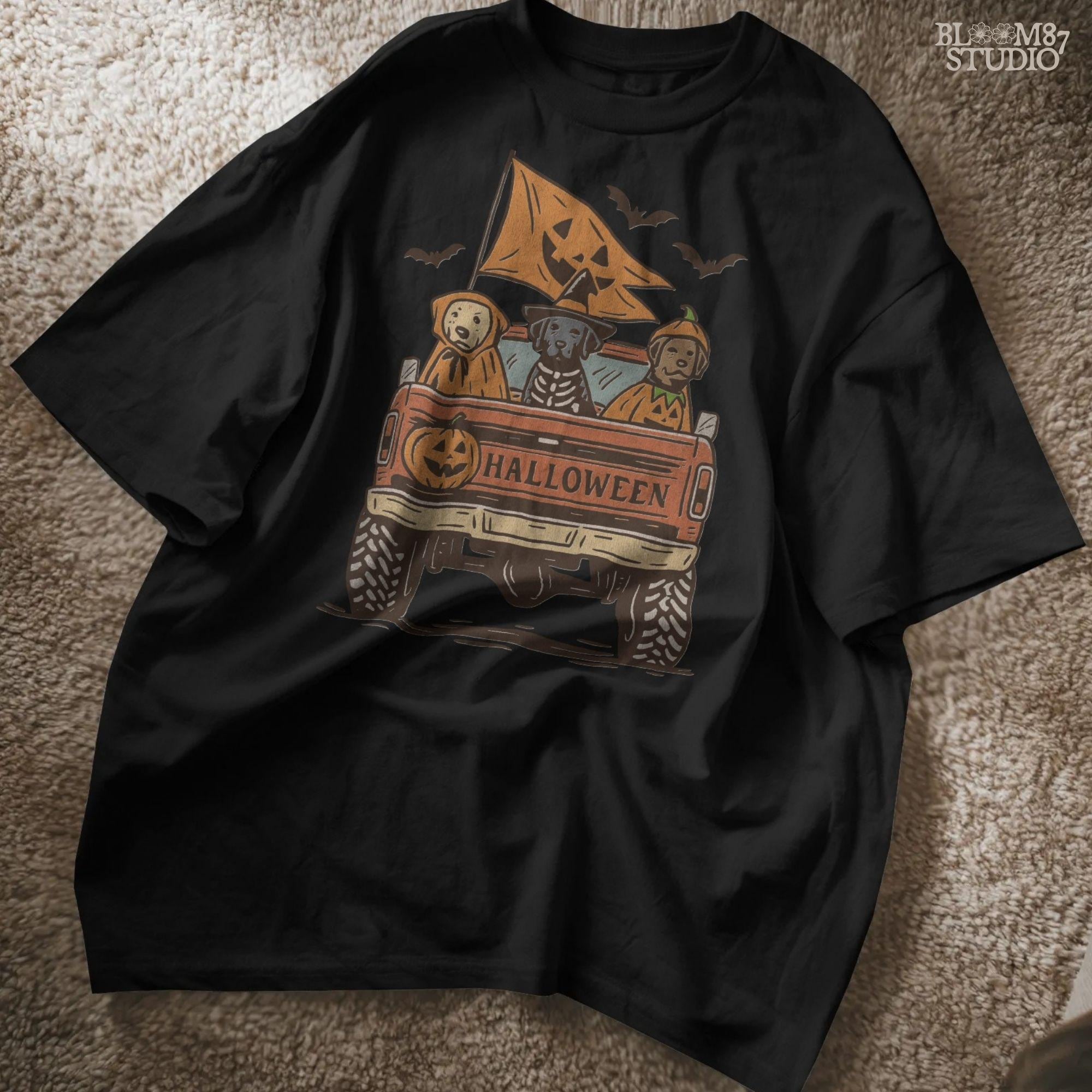 Halloween PNG of three dogs in Halloween costumes riding in a vintage truck with pumpkin flags and bats flying in the background.
