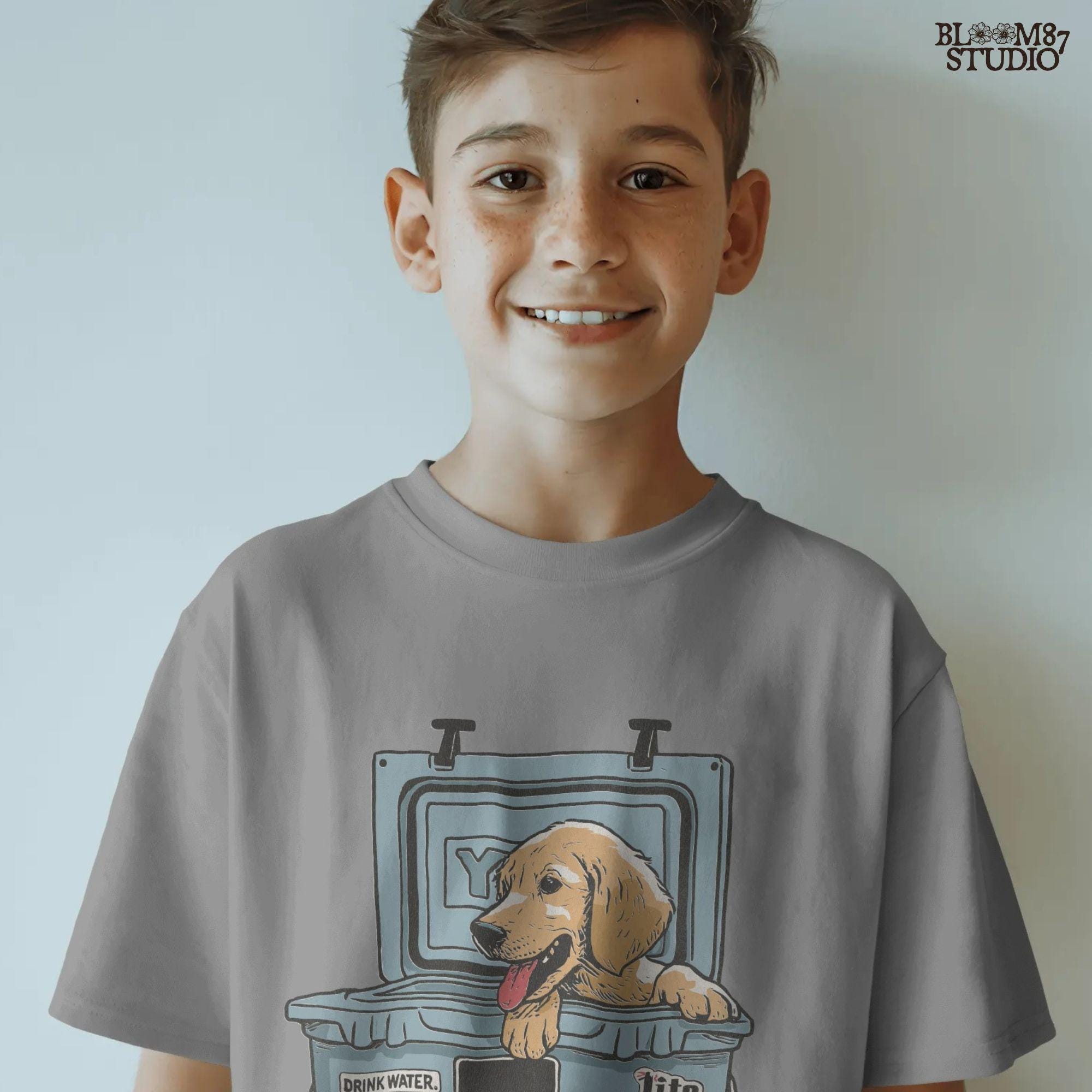 Illustration of a golden retriever puppy sitting inside a YETI cooler covered in stickers, designed for sublimation and lake life dog dad gifts.