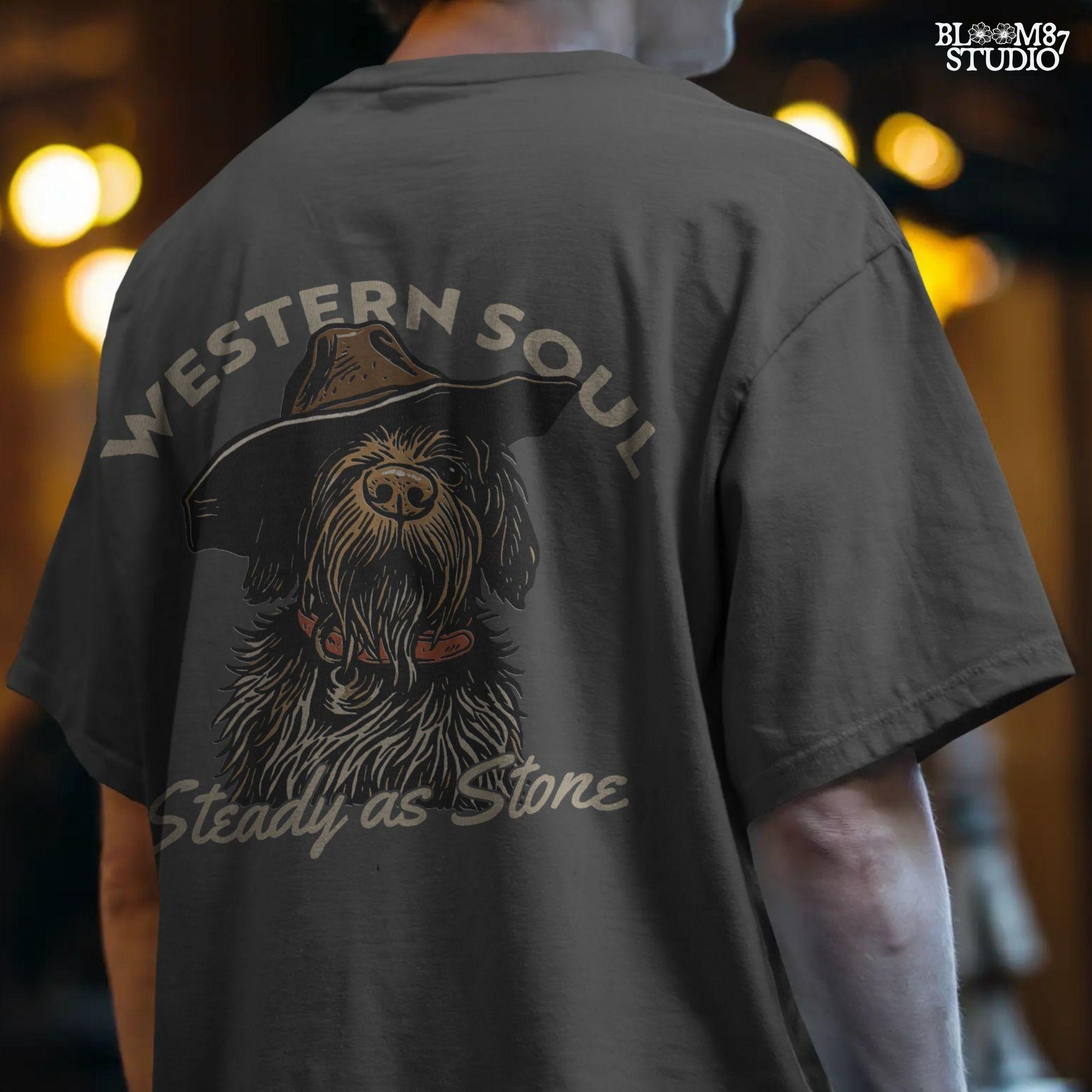 Rustic hunting dog with long fur and cowboy hat, labeled “Western Soul – Steady as Stone,” styled for western-themed sublimation and apparel use