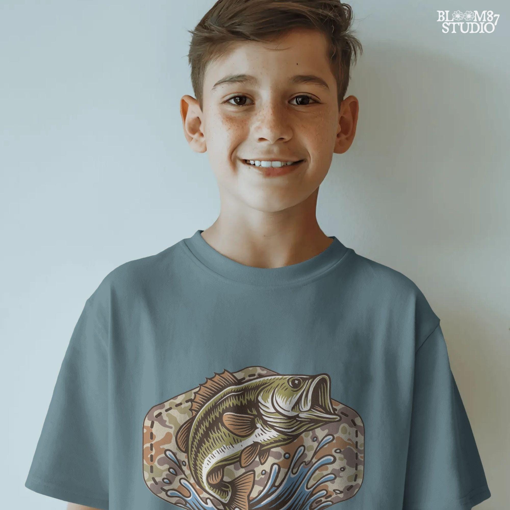 Illustration of a largemouth bass jumping from water with a camo background, designed for fishing-themed sublimation and outdoorsman shirt printing.