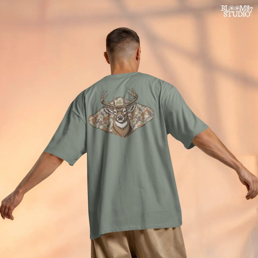 Illustration of a whitetail buck head over a soft-tone woodland camouflage background, designed for fall-themed sublimation and hunting crafts.