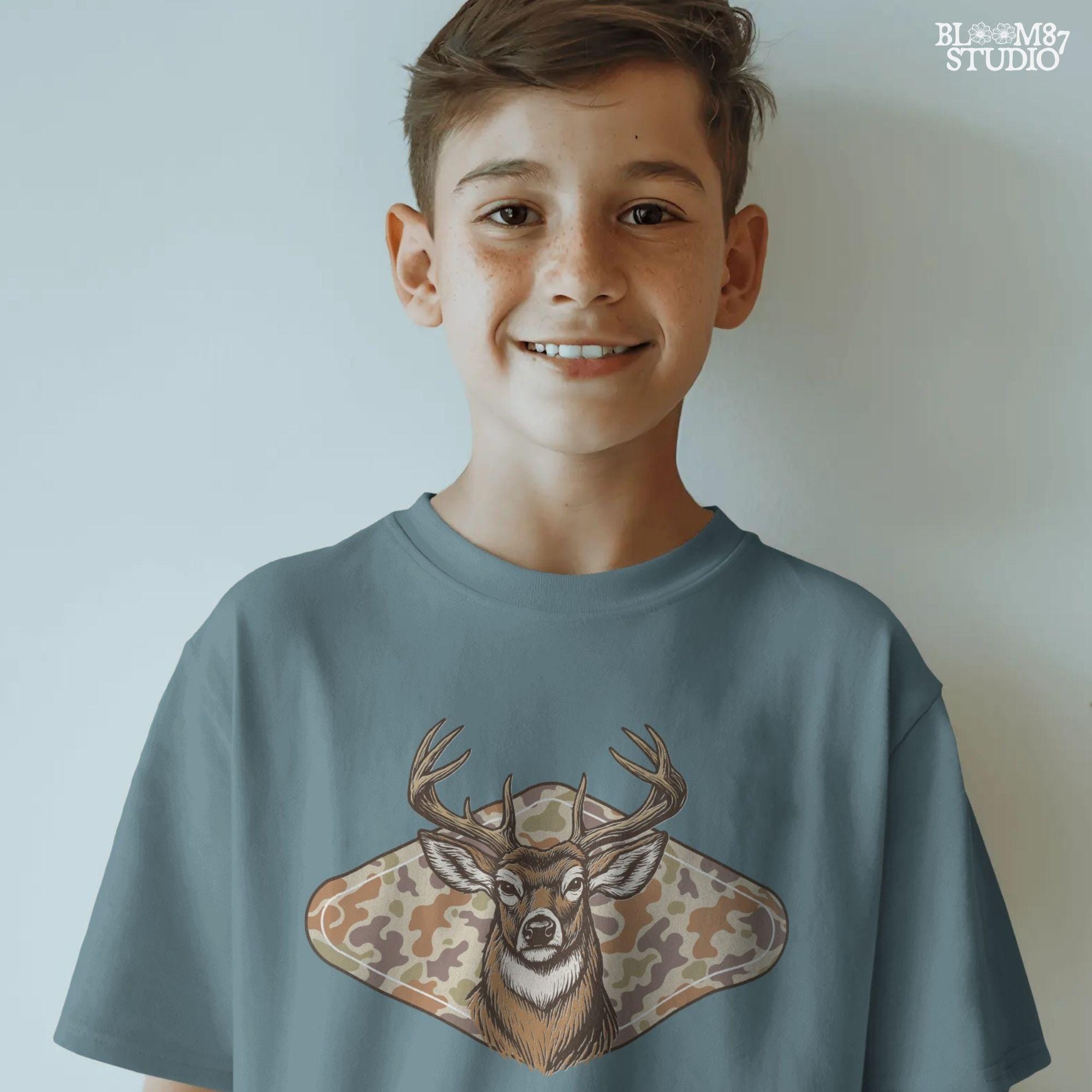 Illustration of a whitetail buck head over a soft-tone woodland camouflage background, designed for fall-themed sublimation and hunting crafts.