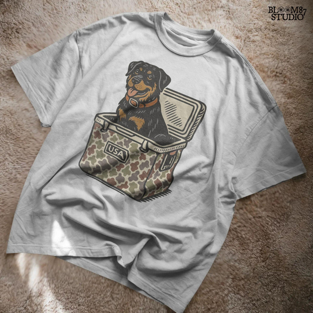 Illustration of a Rottweiler dog sitting inside a camouflage USA cooler, ideal for sublimation designs, hunting shirts, and outdoor pet lovers.
