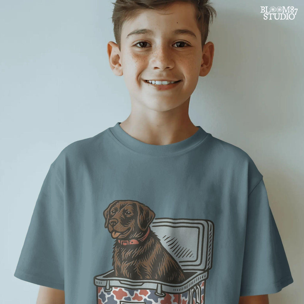 Patriotic sublimation PNG of a brown Labrador sitting inside a red, white, and blue USA-themed cooler, perfect for July 4th crafts and shirts