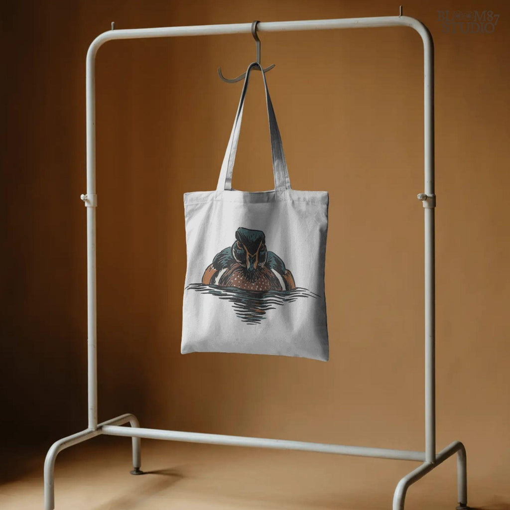 Illustration of a drake wood duck with chestnut, teal, and white plumage swimming on calm water, hunting-themed PNG sublimation design