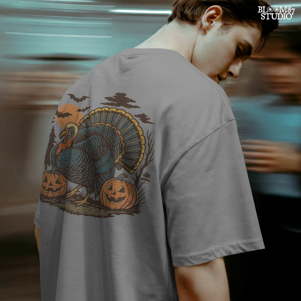 Funny sublimation PNG of a turkey surrounded by jack-o’-lanterns, bats, and a spooky full moon, perfect for Halloween and Thanksgiving crafts