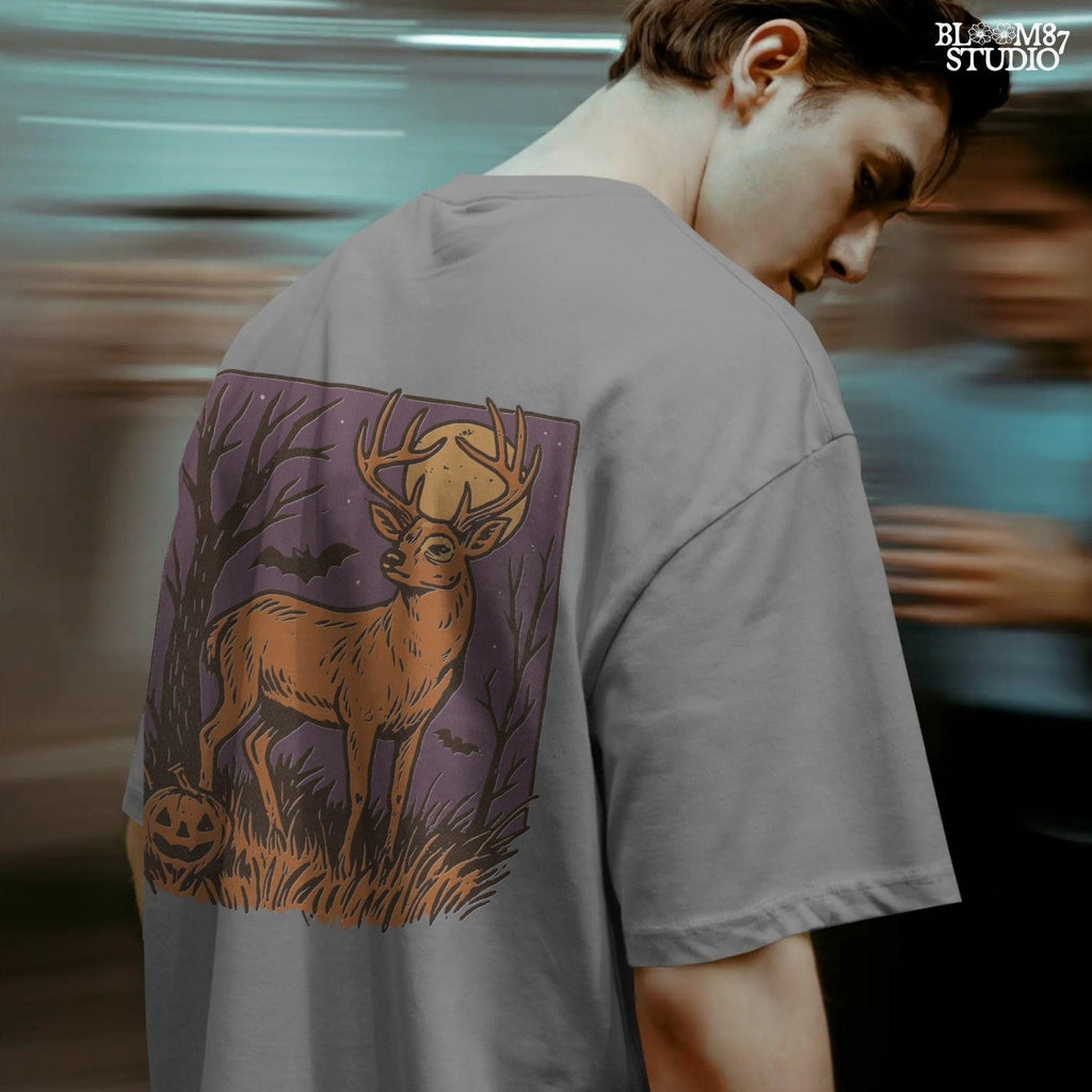 Halloween PNG design of a deer buck under full moon with jack-o’-lantern, bats, and spooky forest background in fall colors