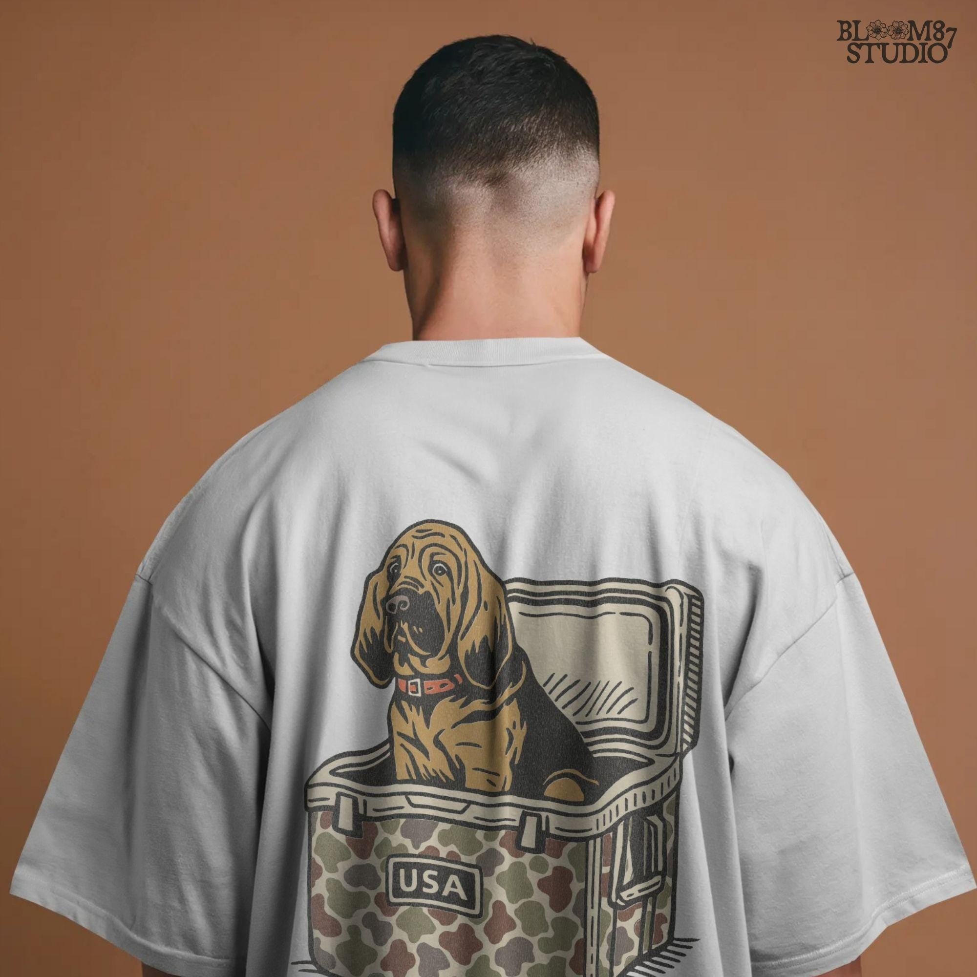 Illustration of a brown bloodhound dog sitting inside a camouflage cooler with “USA” label, hunting and outdoor-themed sublimation PNG design