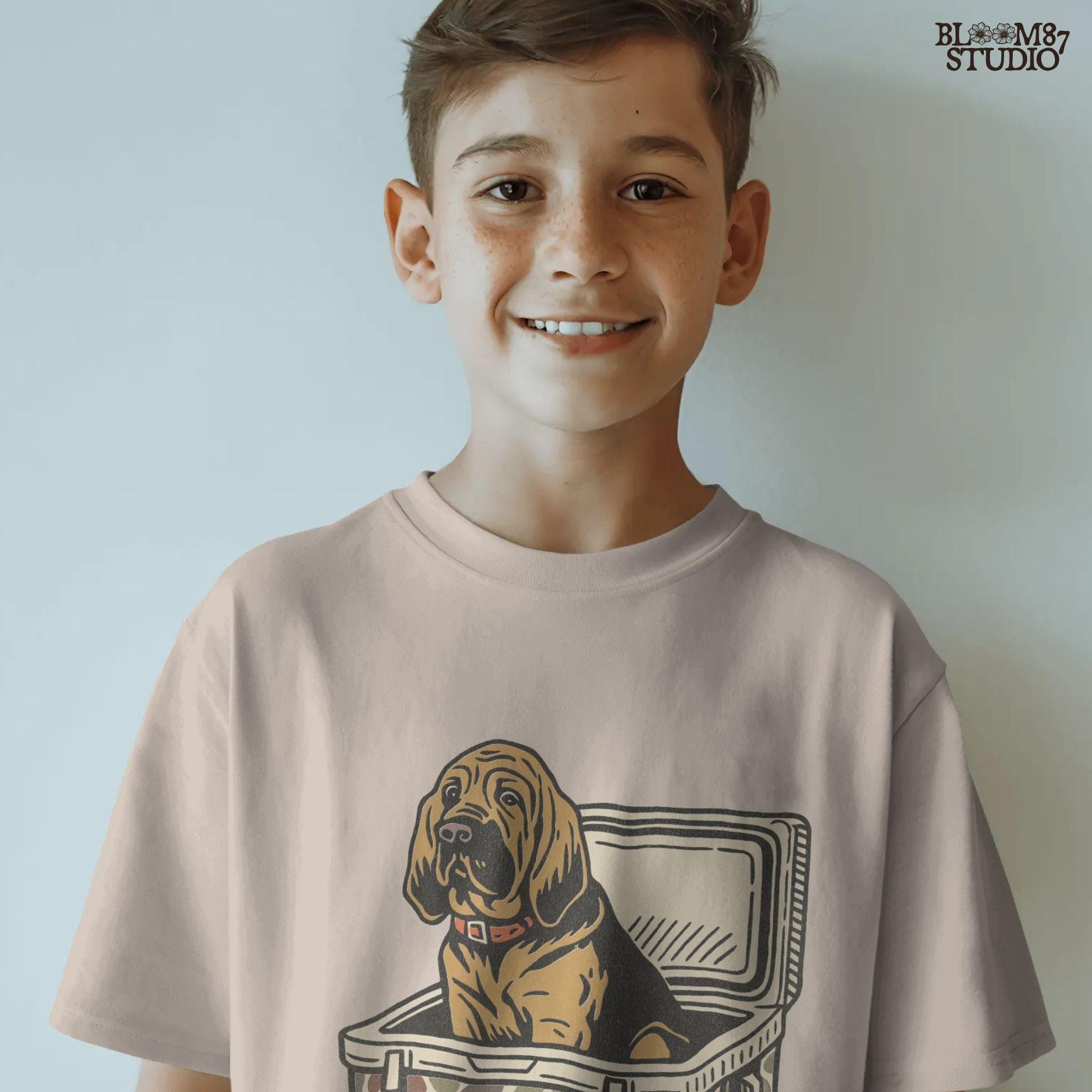 Illustration of a brown bloodhound dog sitting inside a camouflage cooler with “USA” label, hunting and outdoor-themed sublimation PNG design