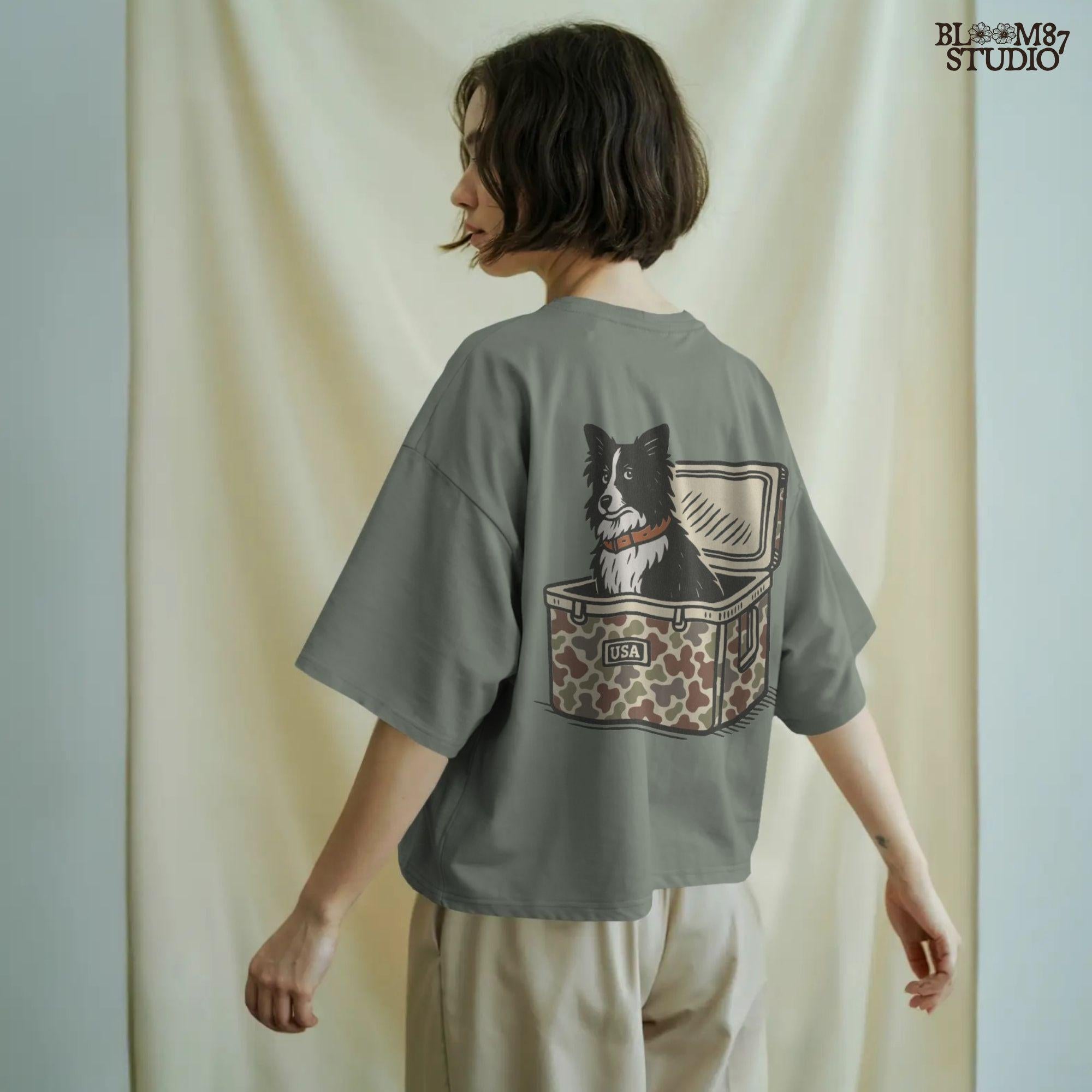 Illustration of a Border Collie sitting inside a camouflage cooler labeled “USA,” rustic farm and ranch-themed sublimation PNG design