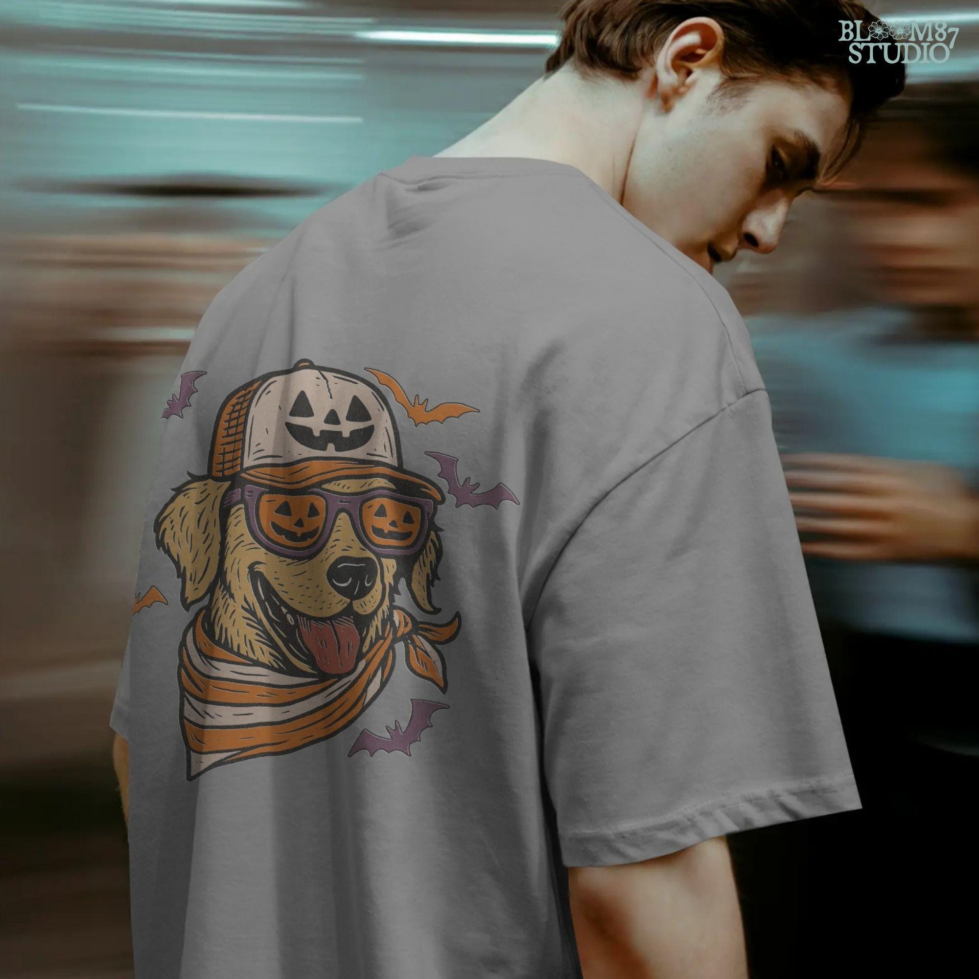 Golden retriever wearing jack-o’-lantern sunglasses, pumpkin hat, and orange bandana, surrounded by bats, Halloween-themed sublimation PNG