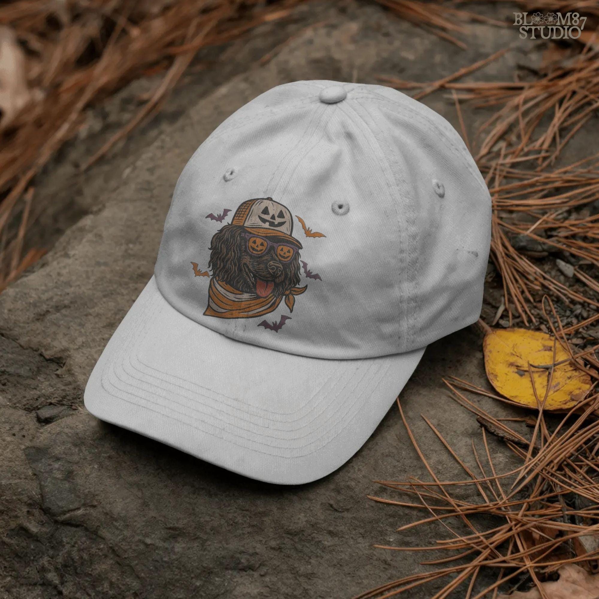 Boykin Spaniel dog wearing pumpkin sunglasses and Halloween hat with bats flying around, spooky sublimation PNG design for fall shirts