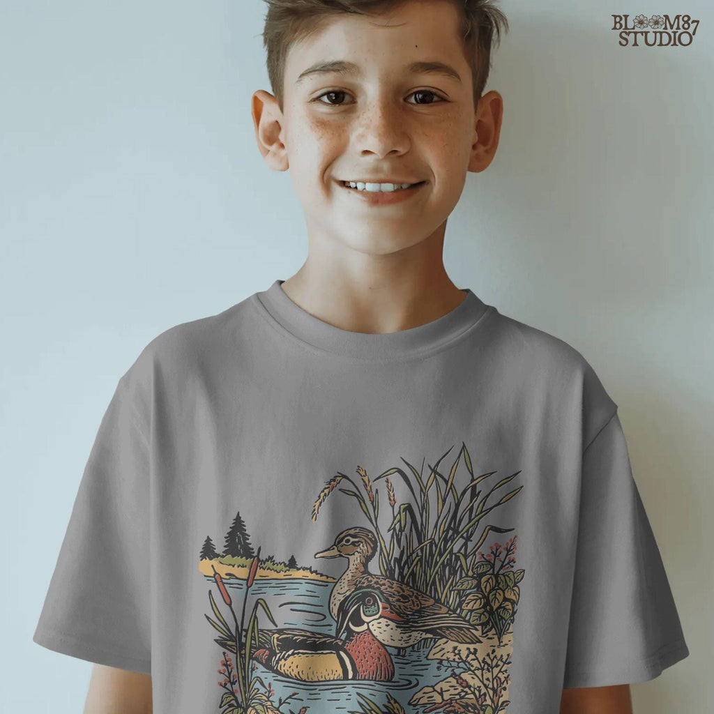 Vintage-style sublimation PNG of two wood ducks in a fall marsh surrounded by cattails and foliage, designed for duck hunting shirts and gifts