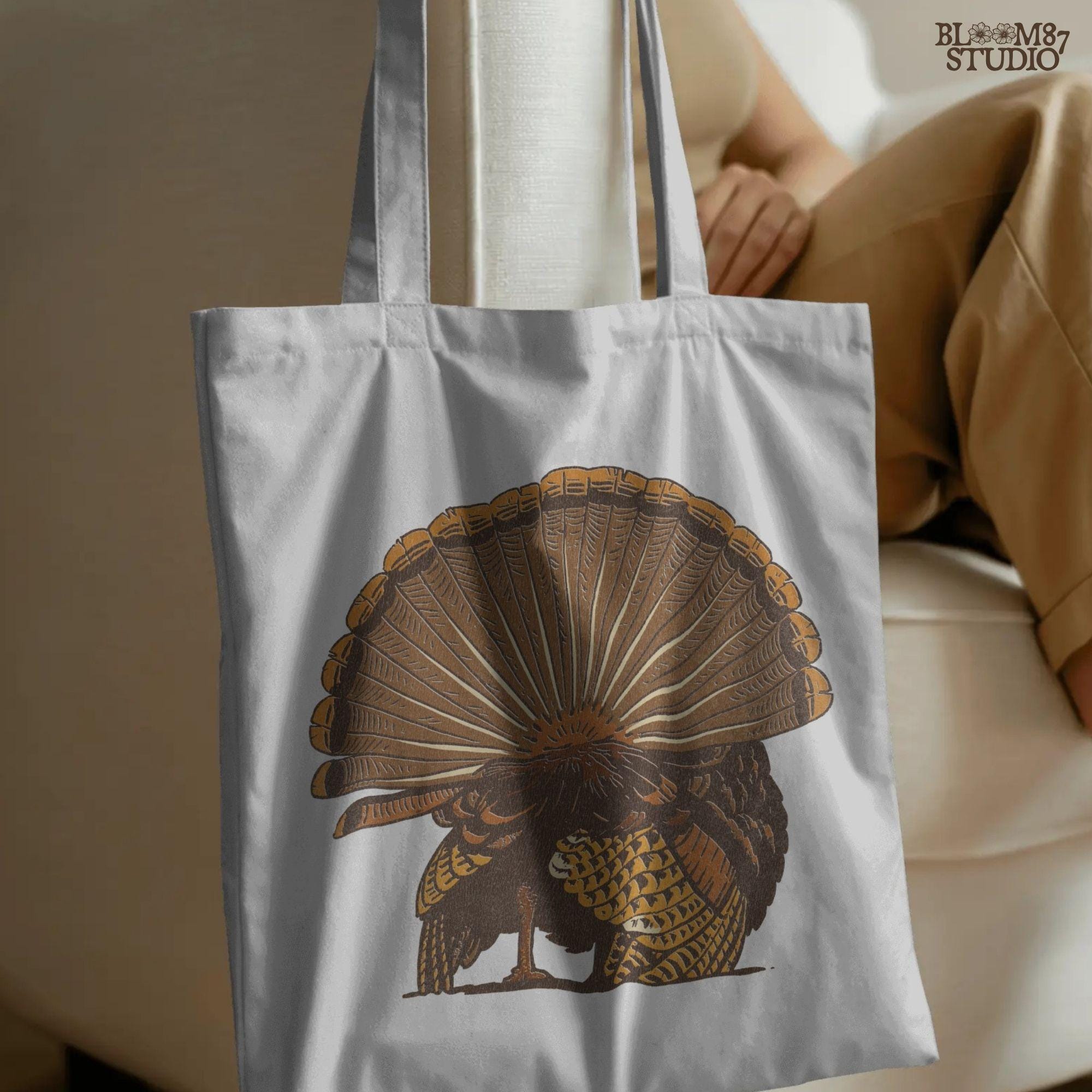 Illustration of a wild turkey from behind with fully fanned tail feathers in brown and golden tones, digital PNG for hunting and Thanksgiving crafts