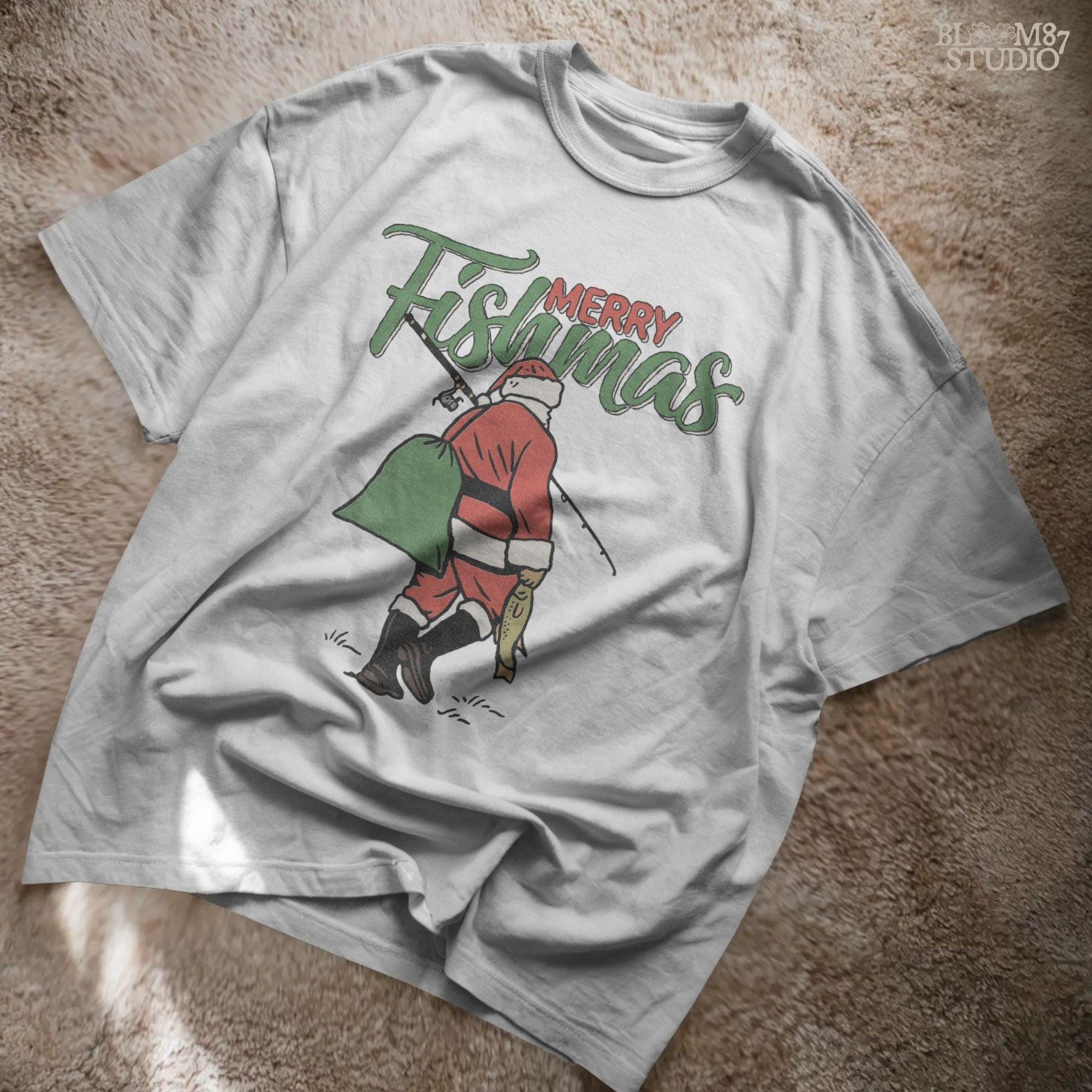 Illustration of Santa Claus walking with fishing rod and fish, “Merry Fishmas” text above, rustic Christmas PNG for sublimation and holiday crafts